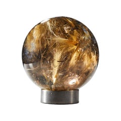 Sphère hypnotique en quartz avec inclusions de rutile doré