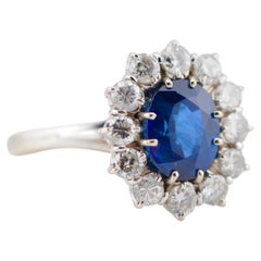 Bague en or à saphir, saphir de 2,58 ct avec halo de diamants