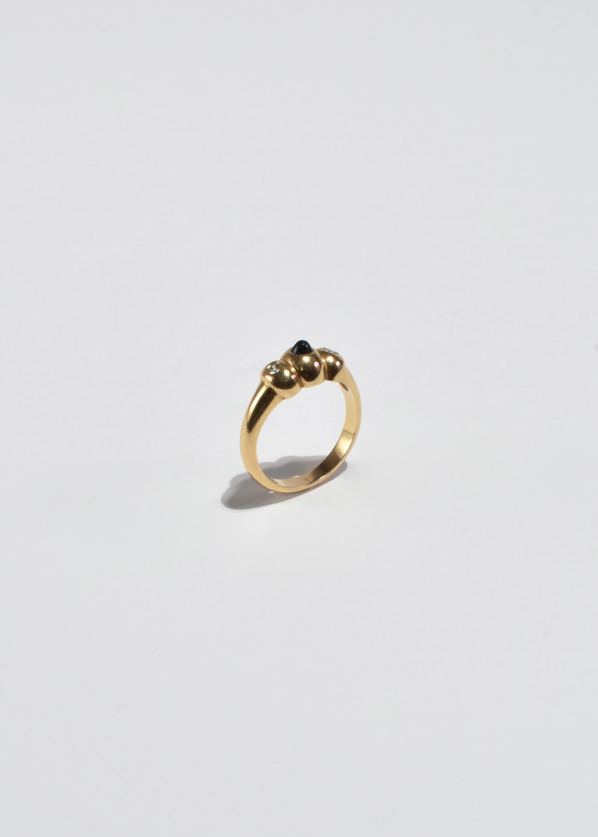Stunning vintage gold ring with sapphire and diamond stones. Stamped 14k.

Material: 14k gold, sapphire, diamond.