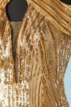 Gold sequin evening dress with split in the front and laces in the back