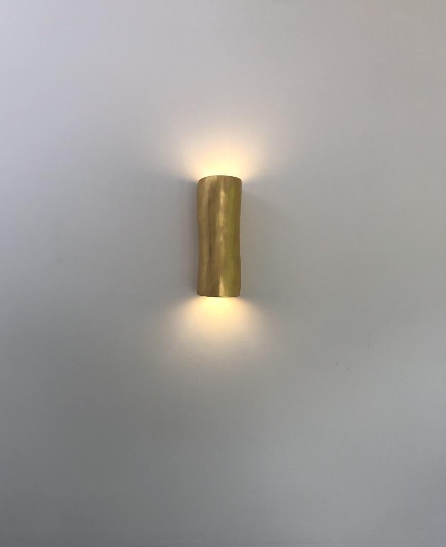 Handmade Serenity (narrow/flat back) ORGANIC MODERN wall sconce, wall light, hand finished in 23.5 carat gold leaf, created by artist Hannah Woodhouse in her London studio. Contemporary design inspired by nature and mid-century European sculpture.