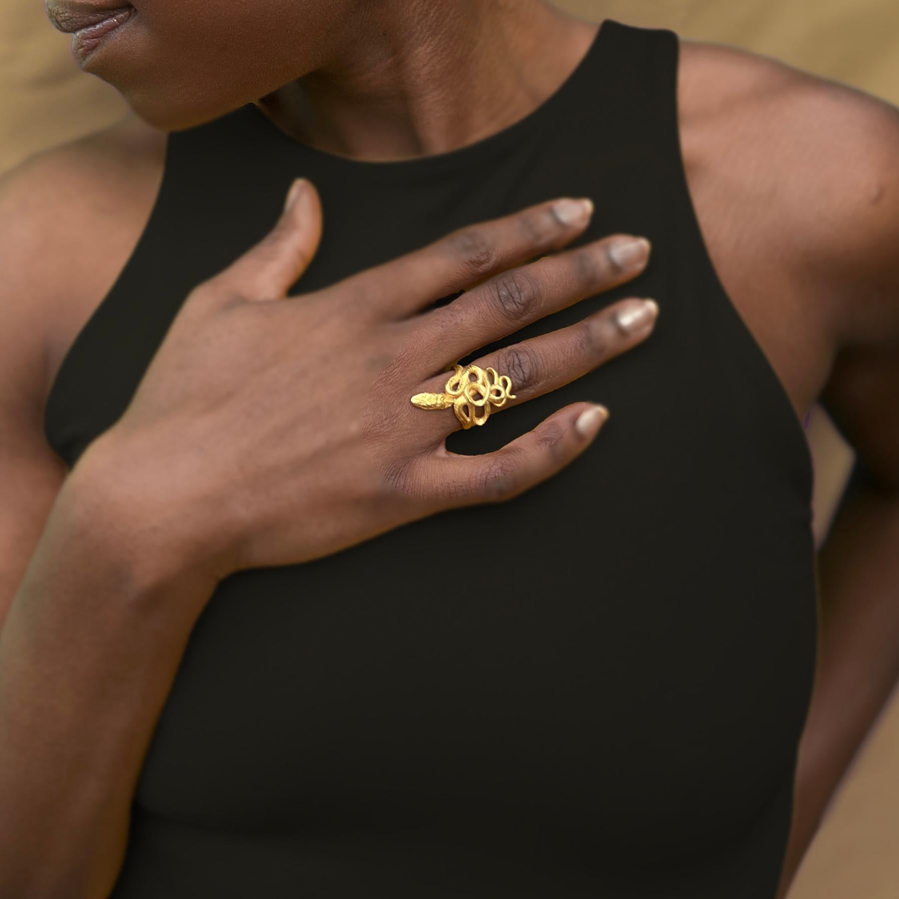 This ring is available in a size 7 and a size 8.5. Please specify your preferred size in the order notes at checkout.

Step into the world of exquisite craftsmanship with the Serpentine Ring in 18k Gold Vermeil. Each piece is meticulously crafted in