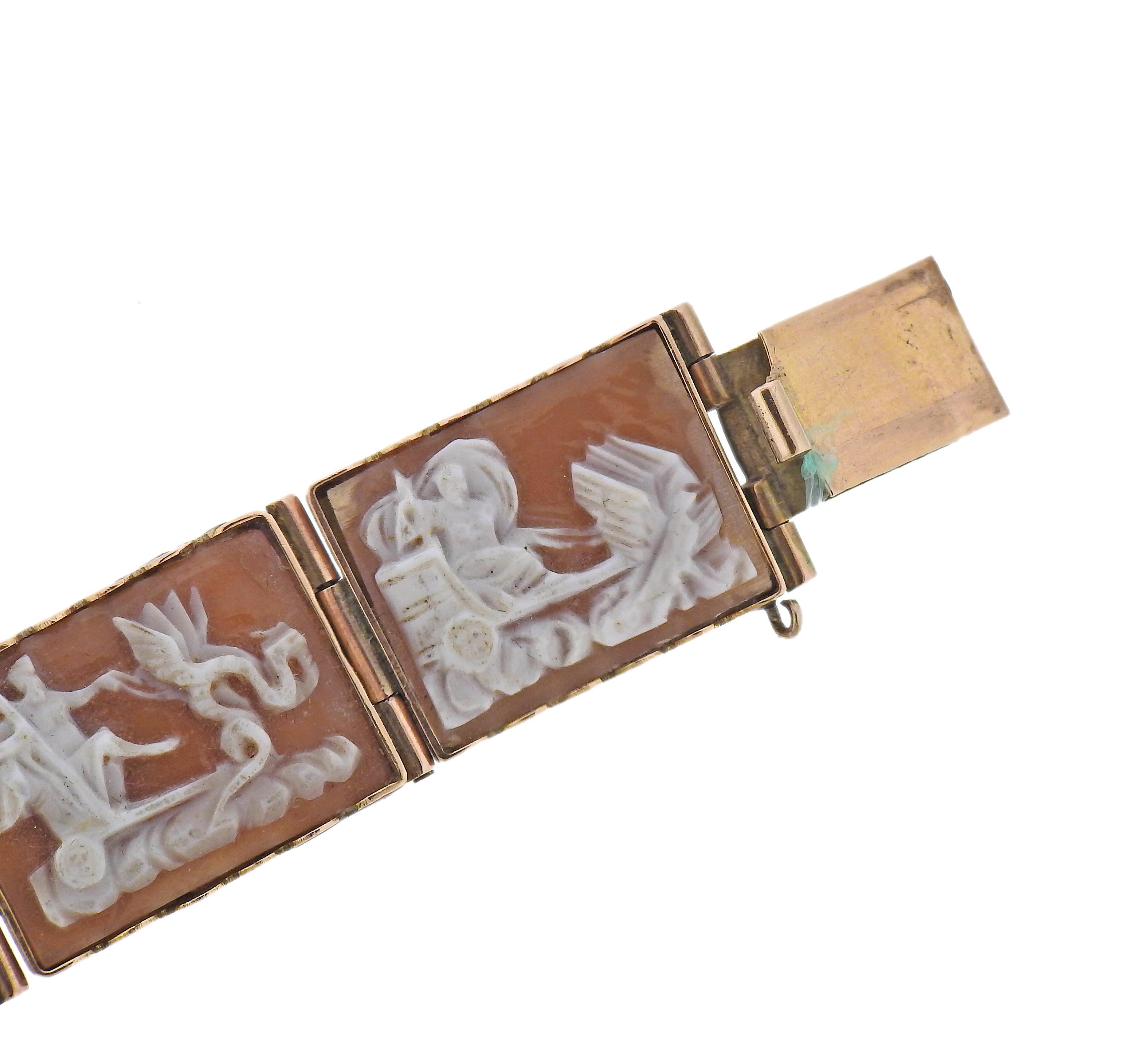 Vintage 14k gold bracelet with 7 shell cameo links (minor damages to cameos are present - all shells are backed with gold in the back). Bracelet is 6 5/8