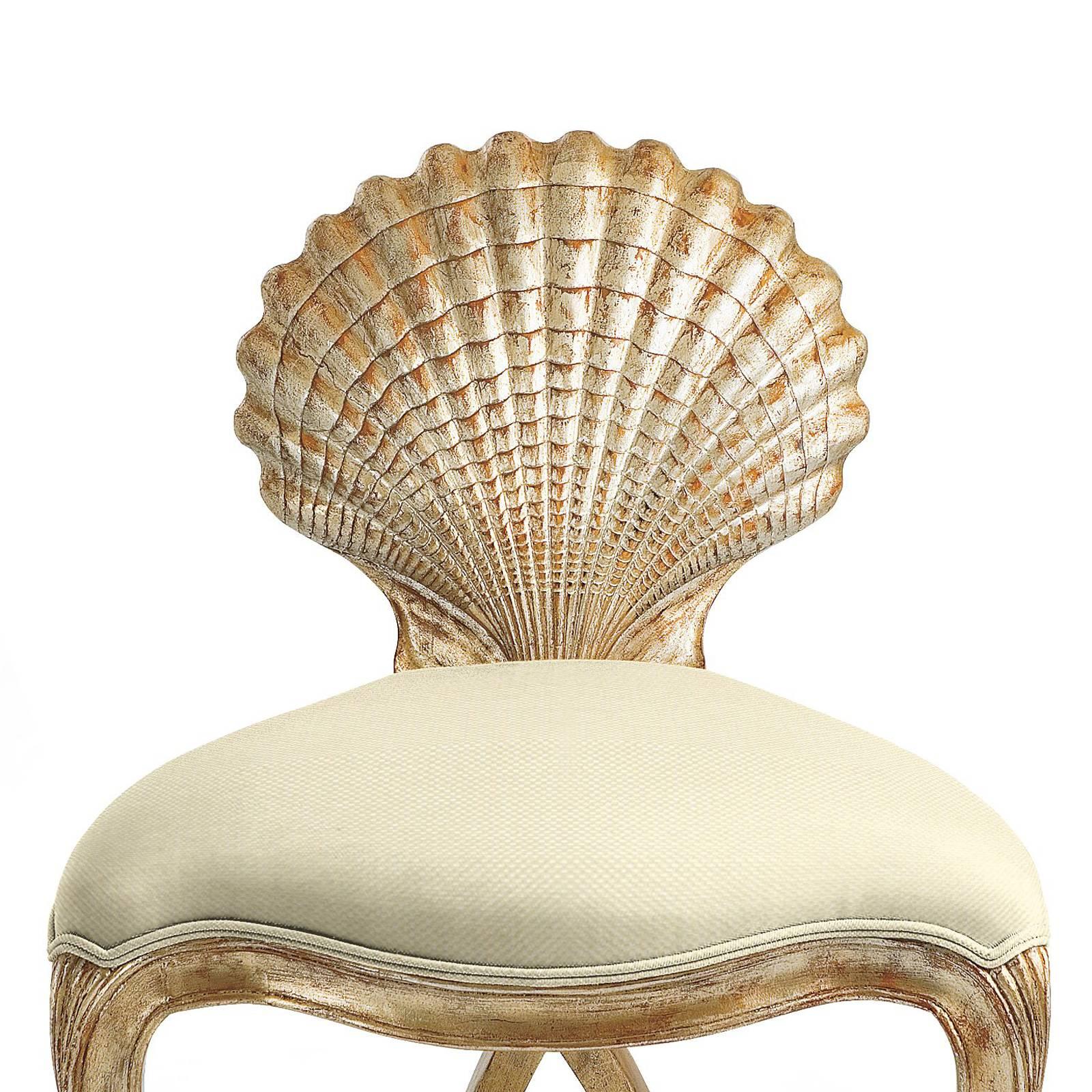 Chair gold shell with structure in hand-carved solid wood
which is hand-painted with silver gilt painting. Covered with
high quality fabric in cream finish. Also available with other
fabrics on requests.