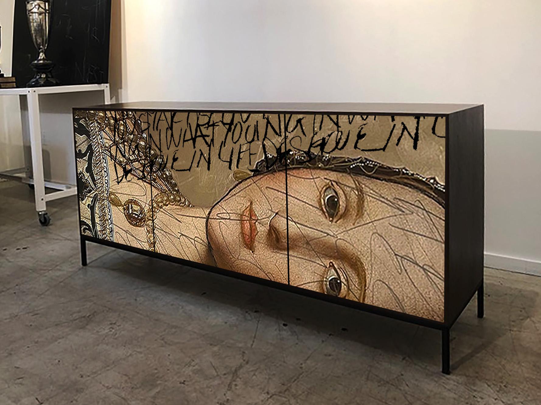 The Gold Side Eye Cabinet by Morgan Clayhall

A striking fusion of classical portraiture and contemporary street art, the Gold Side Eye Cabinet by Morgan Clayhall Studio transforms functional furniture into collectible design. This piece begins with