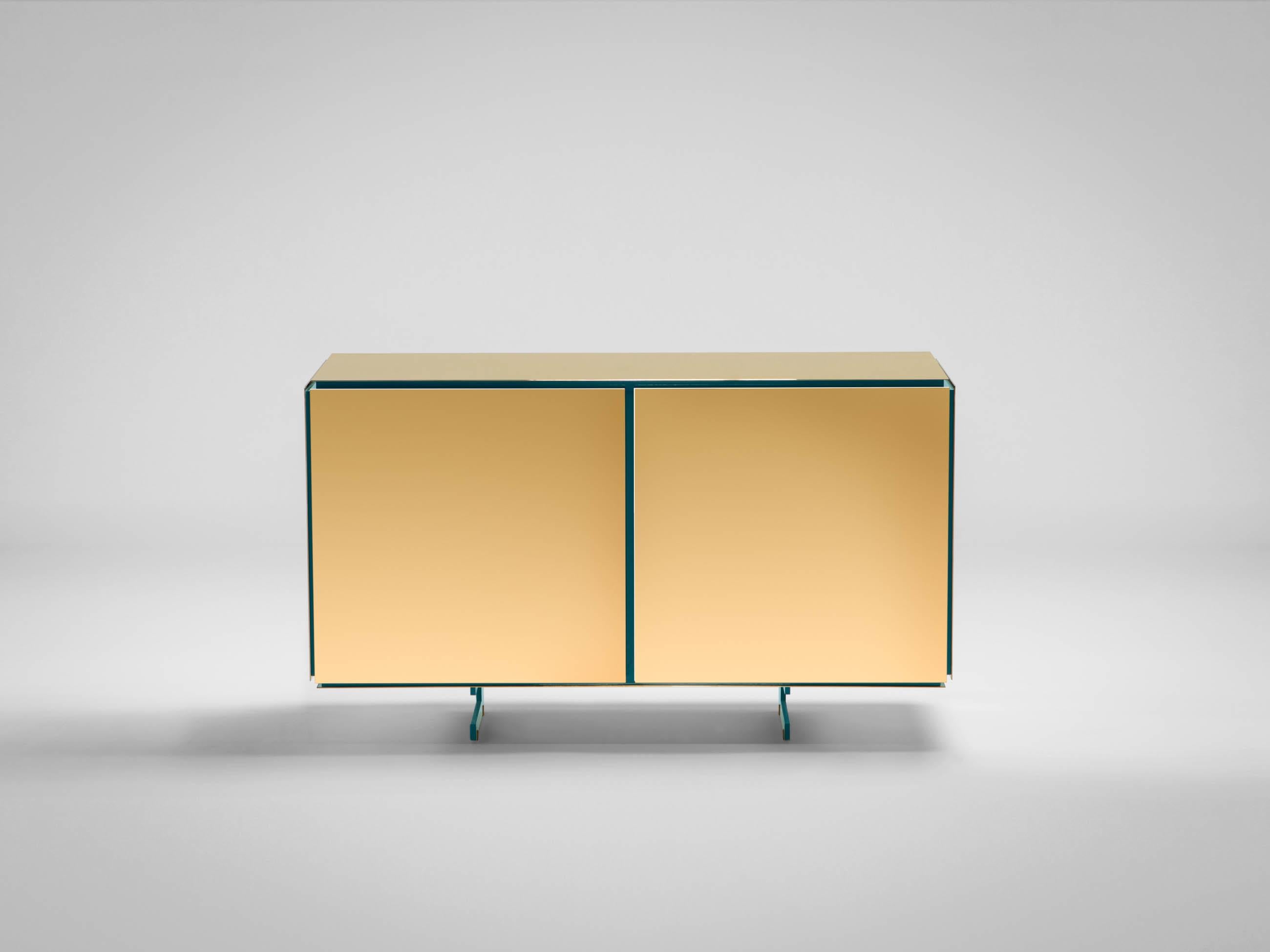Gold sideboard by SEM.
Dimensions: W 120 x D 42 x H 70 cm.
Materials: polished or fine brushed 24kt yellow gold plated, Inlays in lacquered wood.

SEM is a new brand of home furnishings, designed and produced in Italy. The preview show at Milan