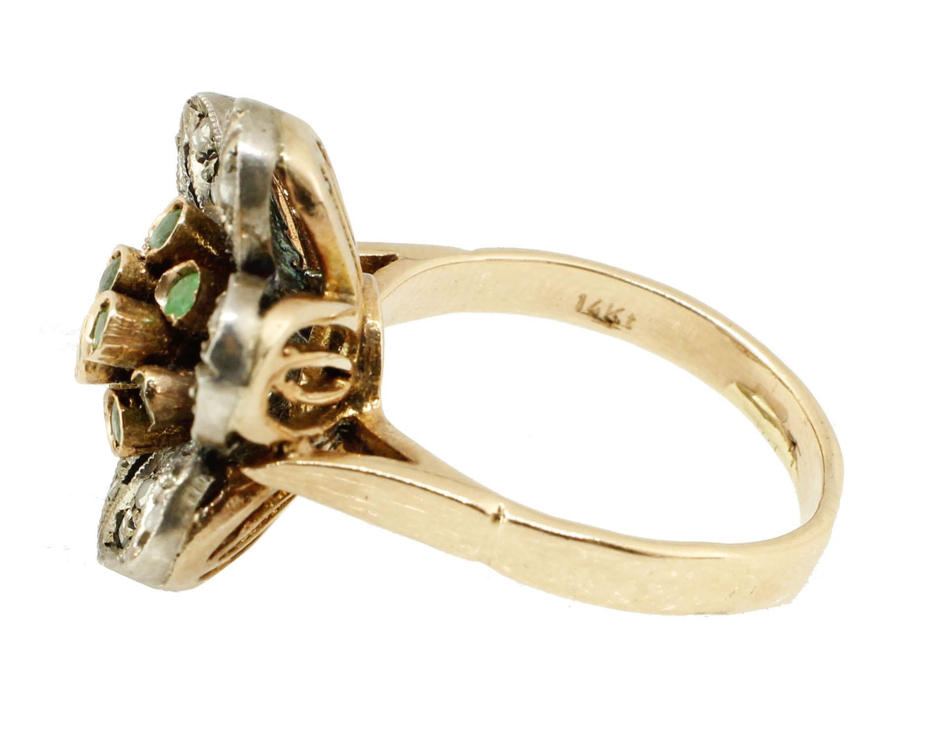 Retro flower shaped ring in 14kt yellow gold and silver composed of petals covered in diamonds that surround the central emeralds.

diamonds 0.26kt
tot weight 8.4gr
r.f.  heu

We hereby inform our customers that in the case of return they will not