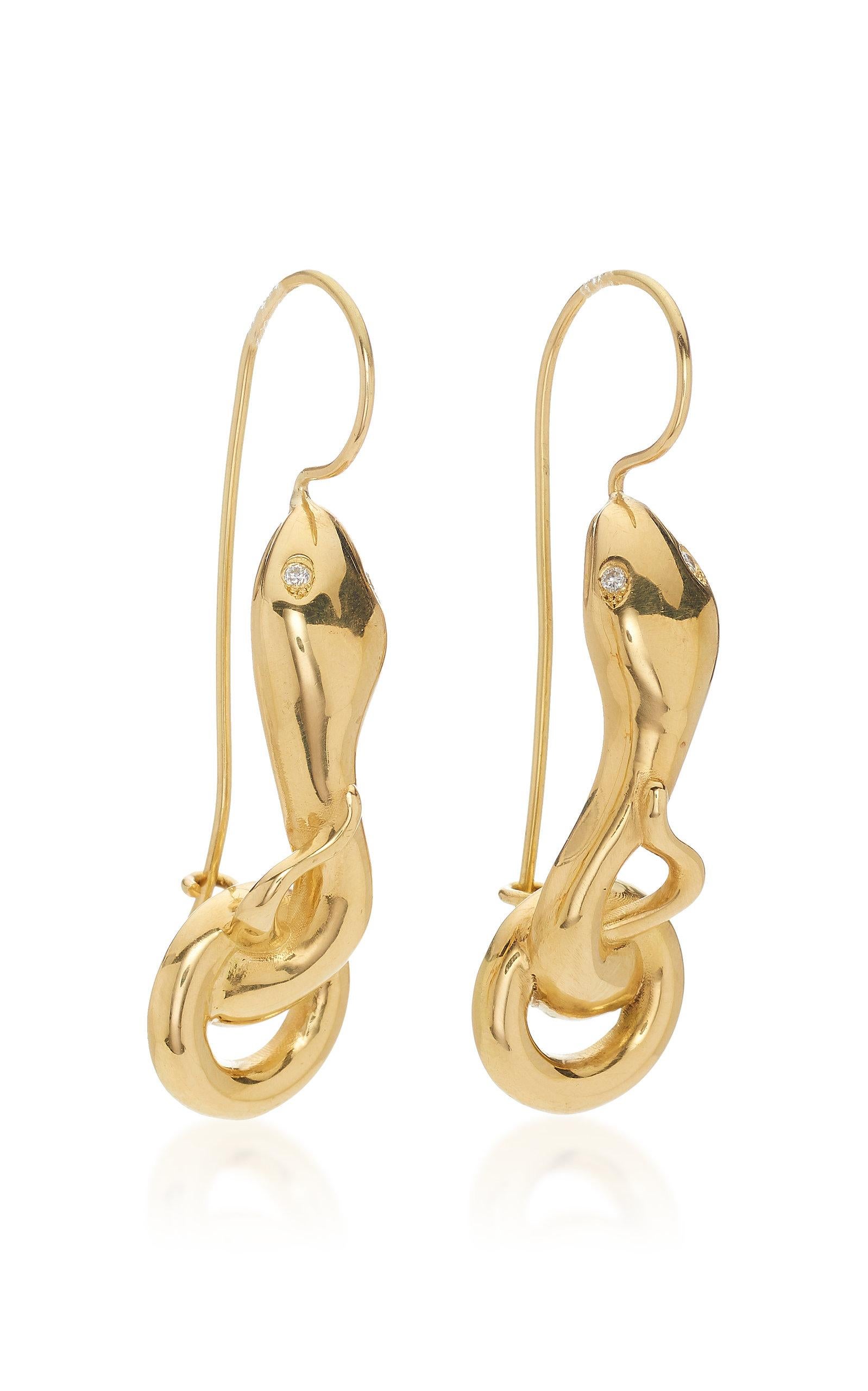 Gold snake earrings with 0.30ct diamond eyes designed by Christina Alexiou. 
This pair of earrings is crafted with 18k yellow gold and has 0.80ct diamond eyes. 
As Christina Alexiou notes, she draws on jewellery's ancient purpose as 
