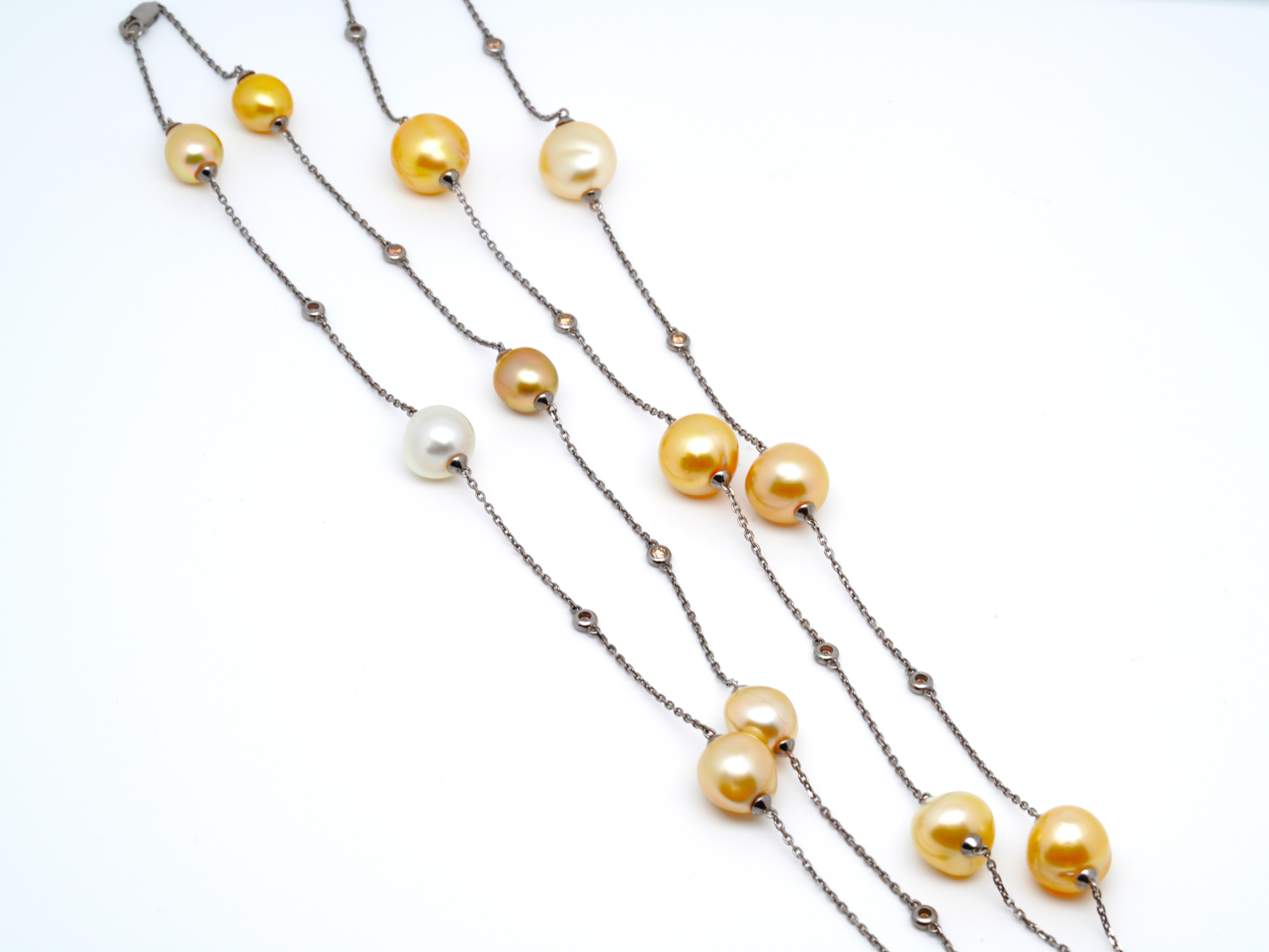 This necklace consist of 15 Gold South Sea Cultured Pearl (with size of 9.5 - 13mm), alternating with 14 round brilliant cut diamonds bezel set in 18K White Gold. The necklace is designed with a lobster clasp so that it can be worn in a single long