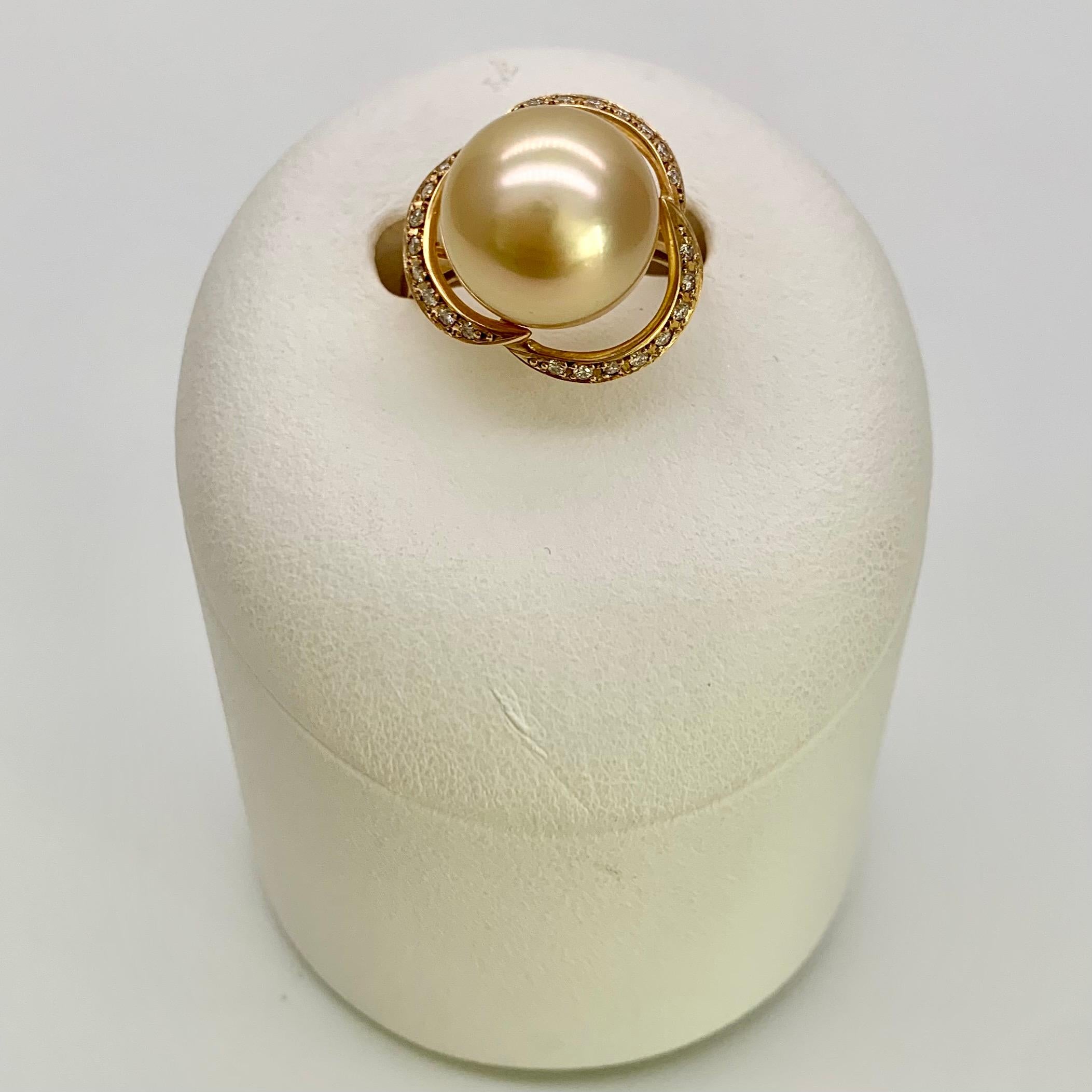 A Single 12.1mm Gold South Sea Pearl set in 18K Gold Diamond Rings with beautiful luster and color, like a flower. Perfect for special occasions.

South Sea Pearls are cultivated in the warm South Pacific which allows them to grow to be among the