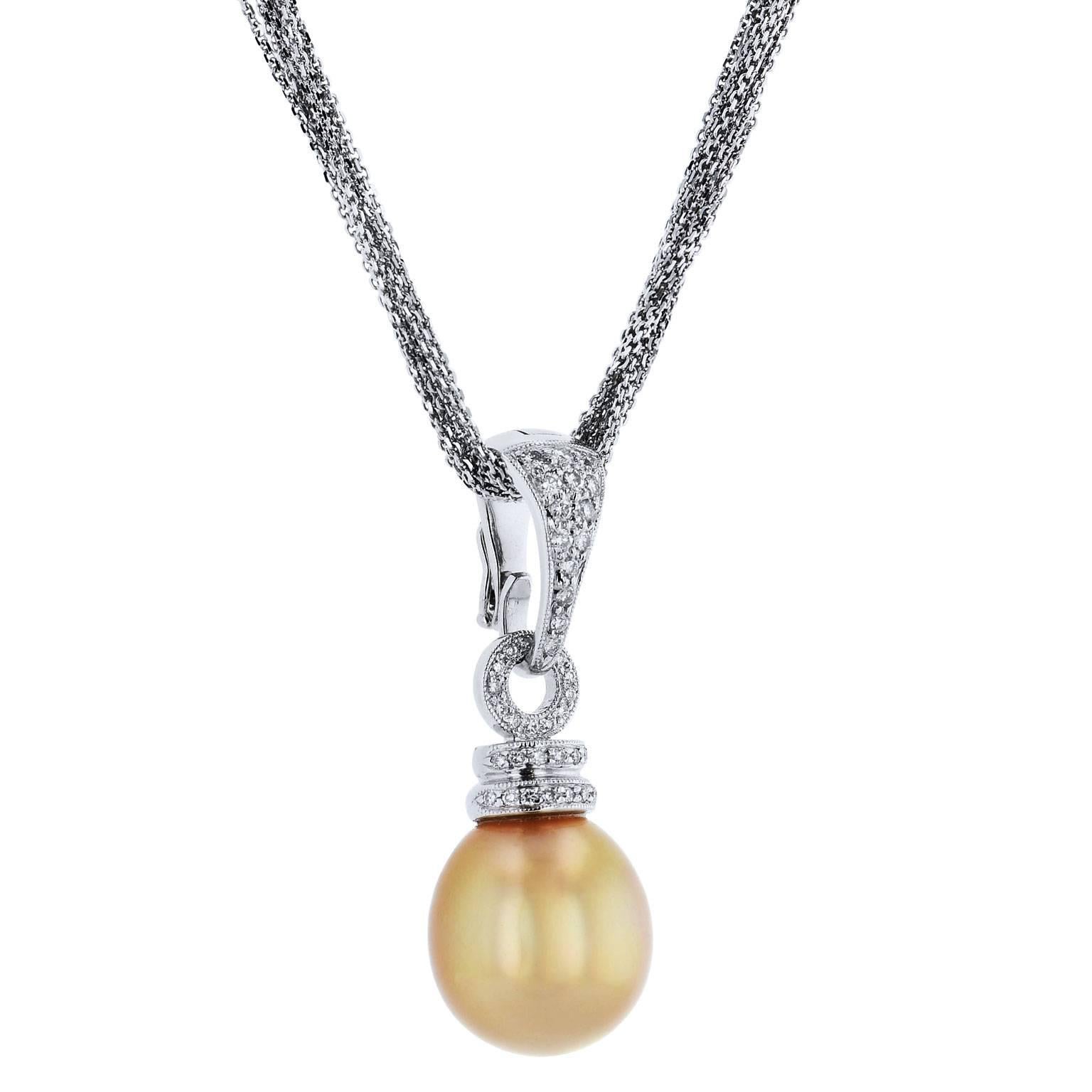Golden South Sea Pearl and Pave Set Diamond Pendant 18 Karat White Gold 

This previously loved 18 karat white gold pendant necklace features a golden South Sea pearl measuring 15 x 13 millimetres and 0.50 carat of pave-set diamond up the bail. 
