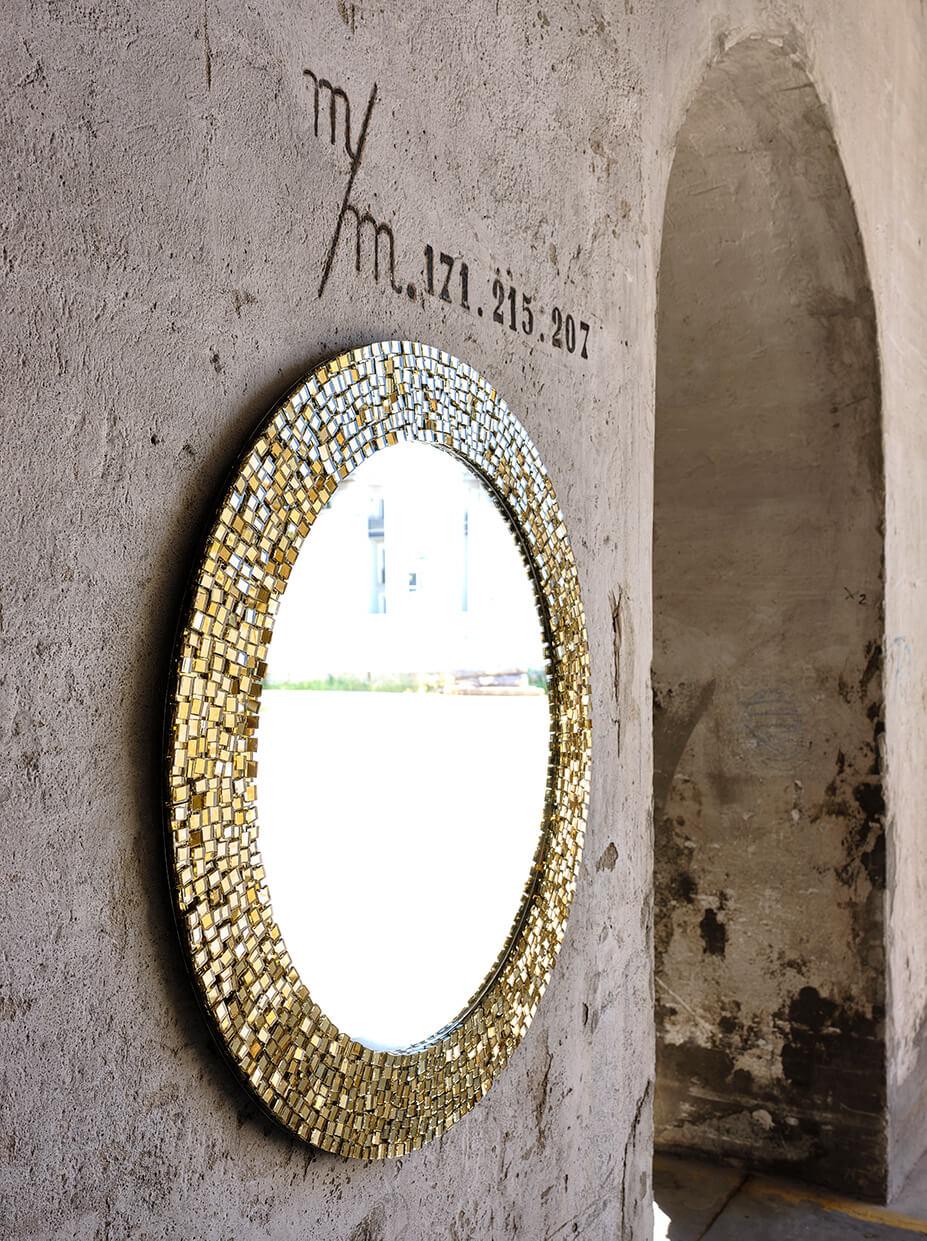 Gold Sovrapposto round mirror by Davide Medri
Materials: mirror, glass mosaic
Dimensions: D 100 x H 100 cm
Also available in silver, other sizes and square shape.

Davide Medri was born in Cesena on August 7th 1967 and graduated at the Academy