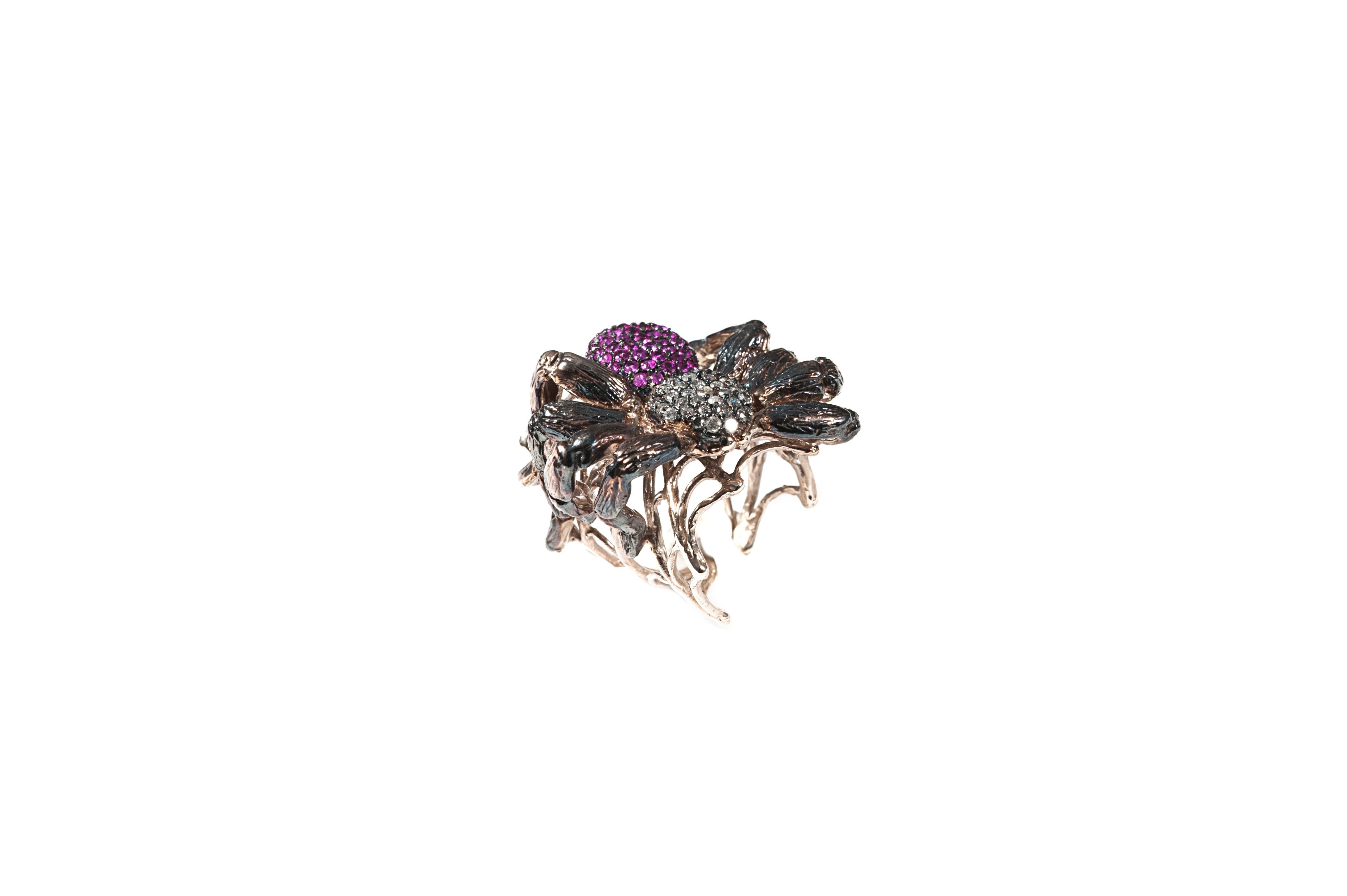 Spider and web ring pavè

Composition: 
Gold 22,15 gr (9K)
69 fuxia sapphires 2,07 ct
41 grey diamonds 1,02 ct

Size is adjustable from 6 US to 8 US ( italian size from 12 to 17)
Other sizes on demand, working time approx 15 days.
