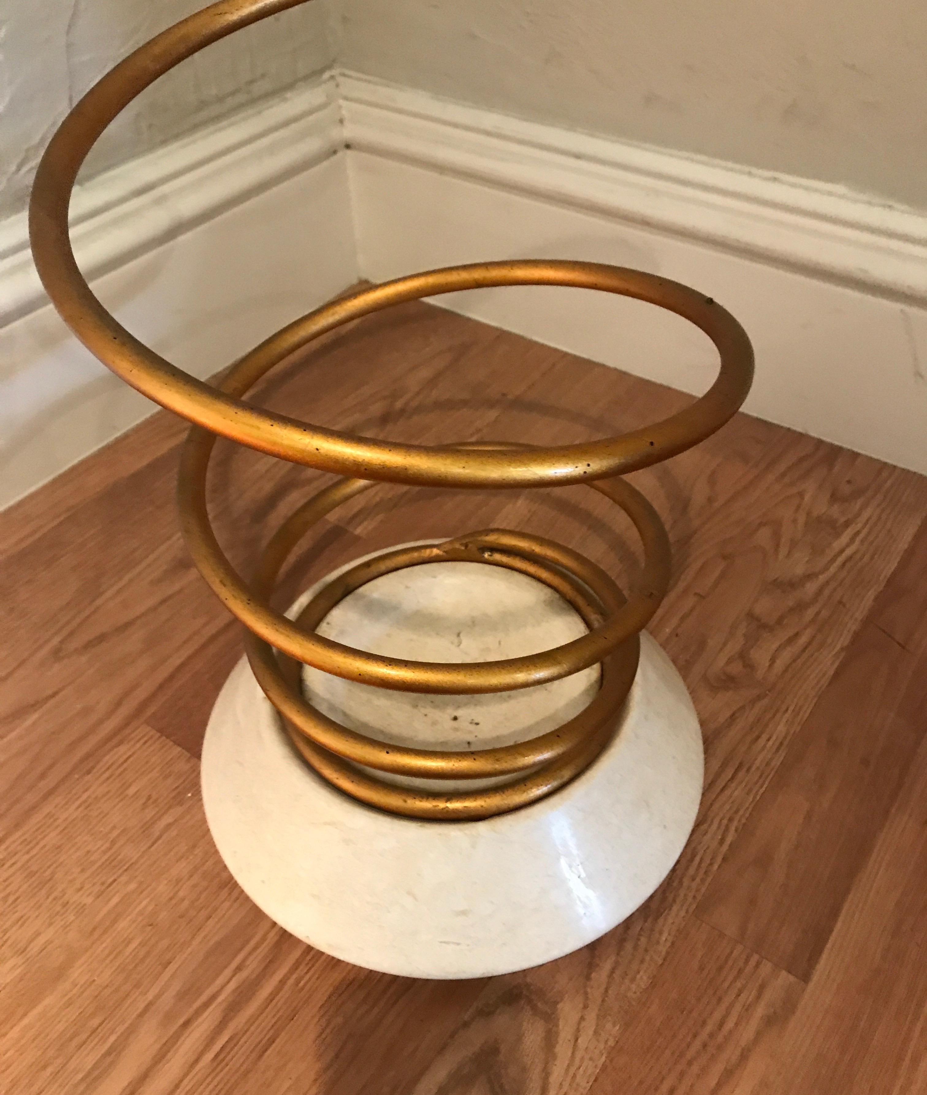 Gold metal spiral umbrella stand by Bunny Williams in the midcentury style of Dorothy Thorpe.