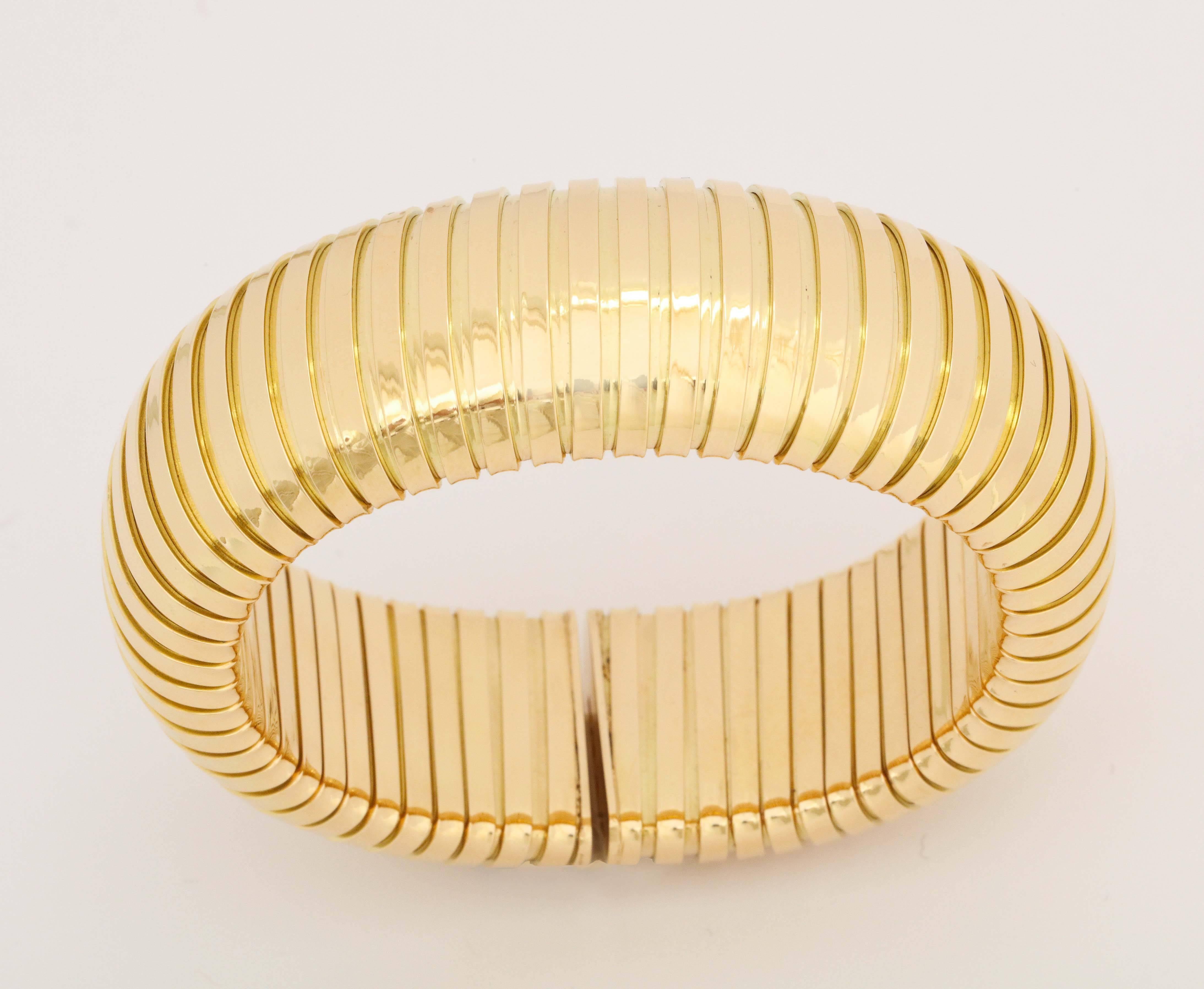 18k yellow gold tubogas bracelet
25mm wide  
