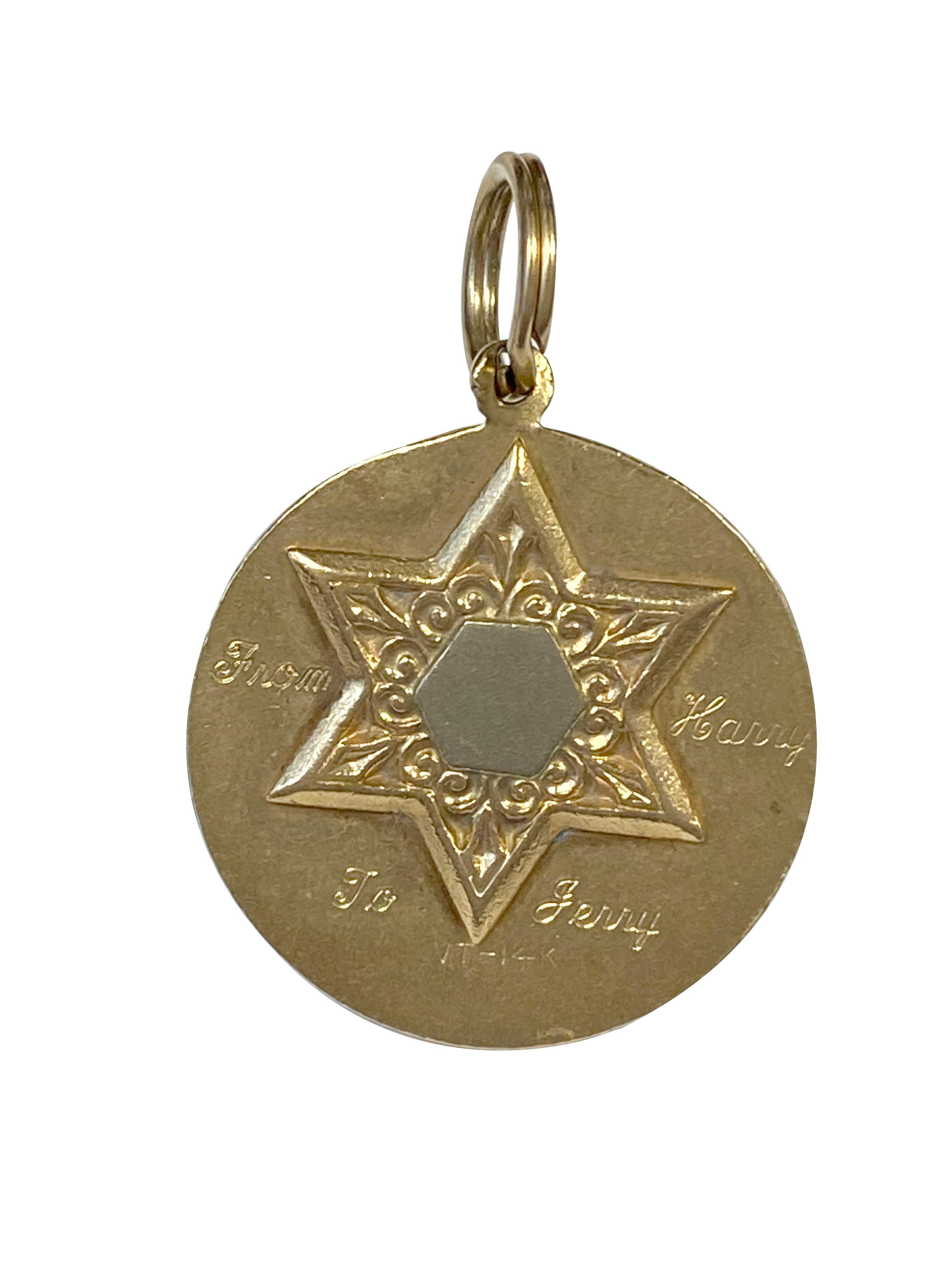 Circa 1960s 14k Yellow Gold pendant  / medal  owned and worn by Hollywood Icon Jerry Lewis, measuring 1 inch in diameter and weighing 6.4 Grams. The figural St. Christopher Medal has a Star of David on the Reverse with a personal engraving: 
