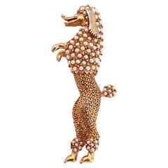 Gold Standing Poodle Dog Figural Brooch With Seed Pearl Pavé By Ciner, 1950s