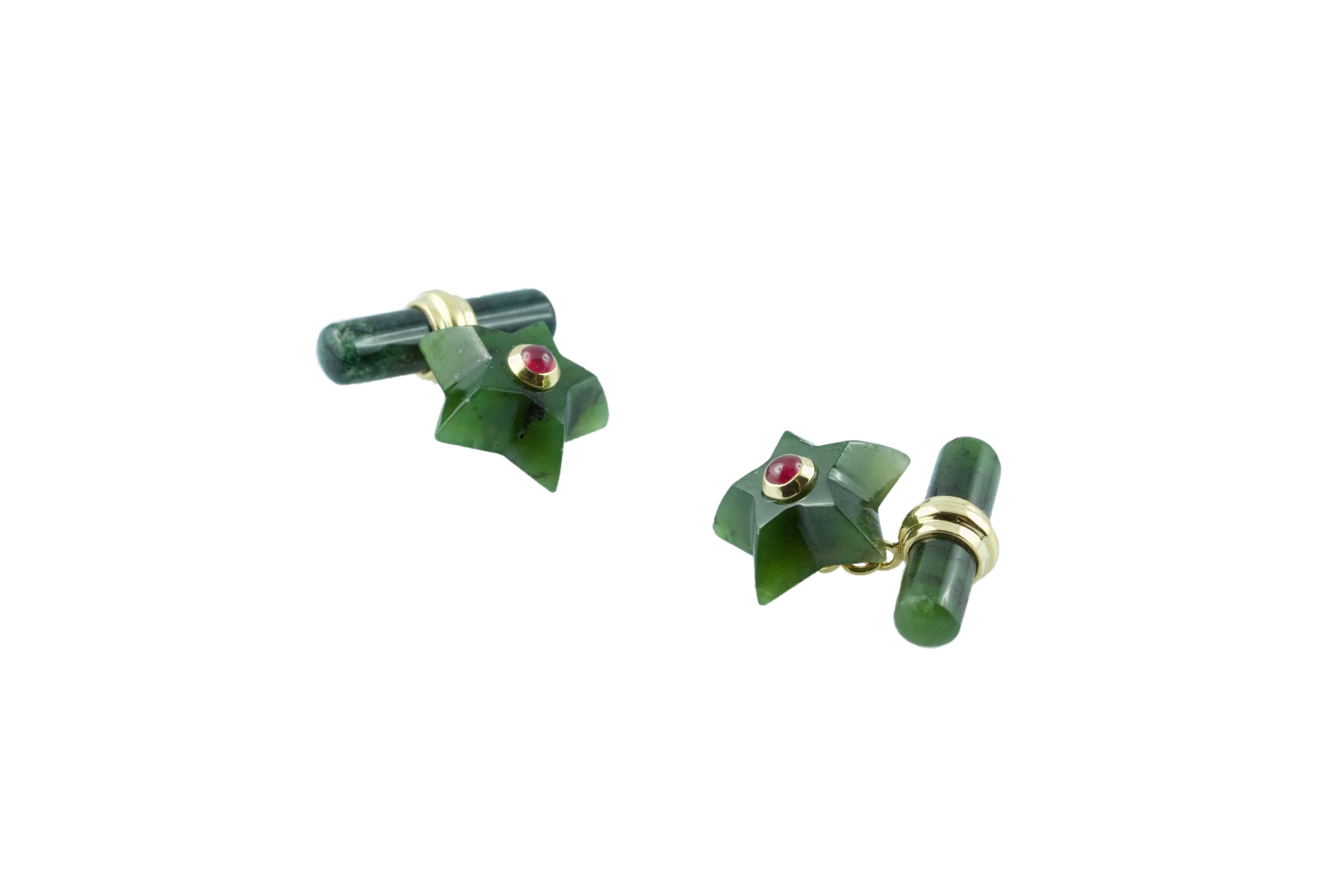 This charming pair of cufflinks is entirely made in Jade shaped as stars and adorned in the center with cabochon rubies. The 18k yellow gold post links this element to the toggle, which is a simple cylinder.