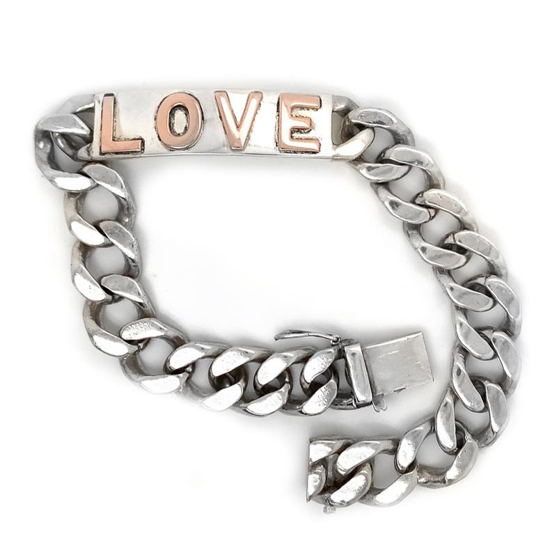 Chunky solid link bracelet.  Sterling silver, with a center plaque.  14K rose gold letters spelling out  
