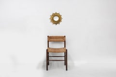 Gold sunburst mirror in resin with convex mirror, France ca. 1960