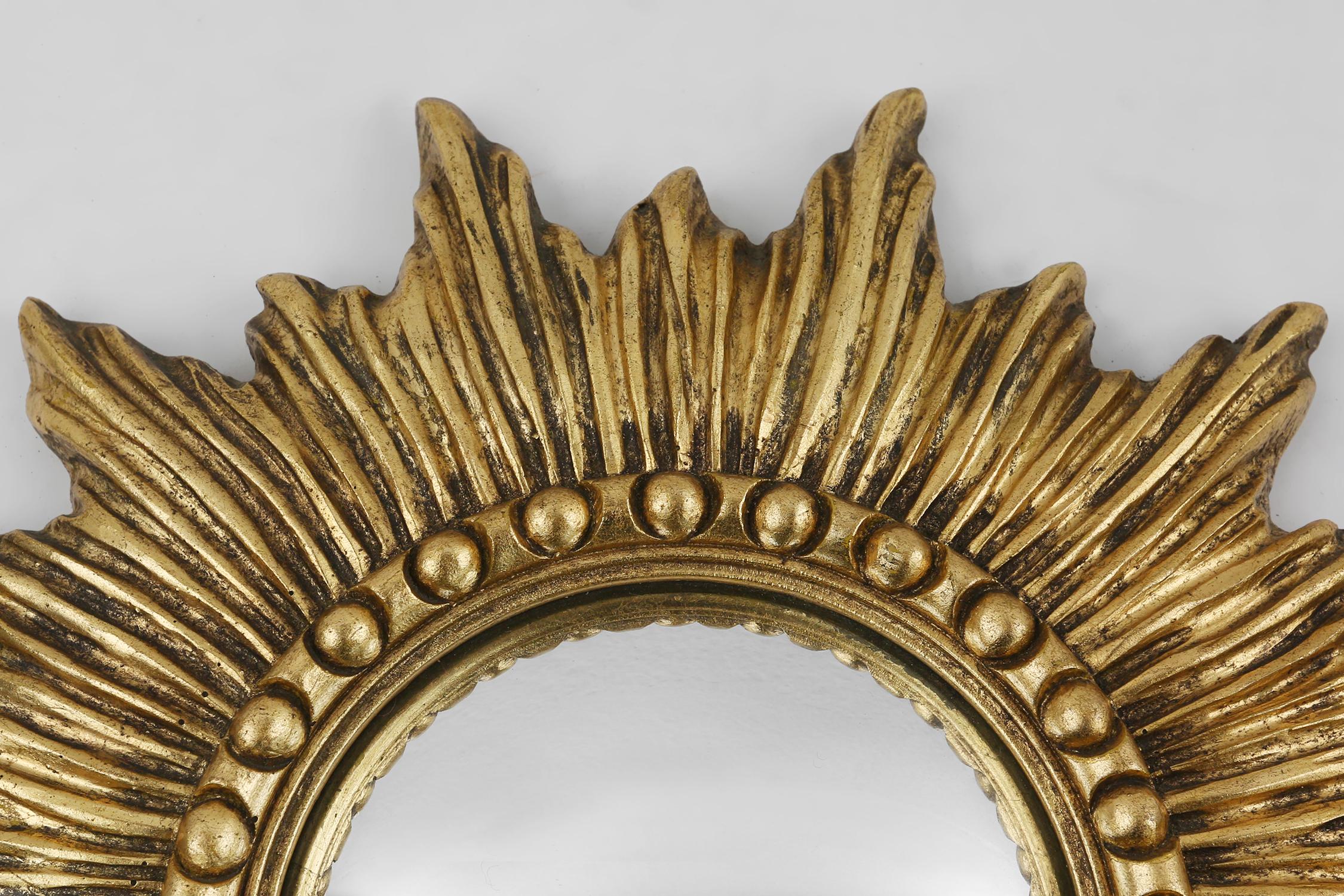 French Gold sunburst mirror in resin with convex mirror, France ca. 1960 For Sale