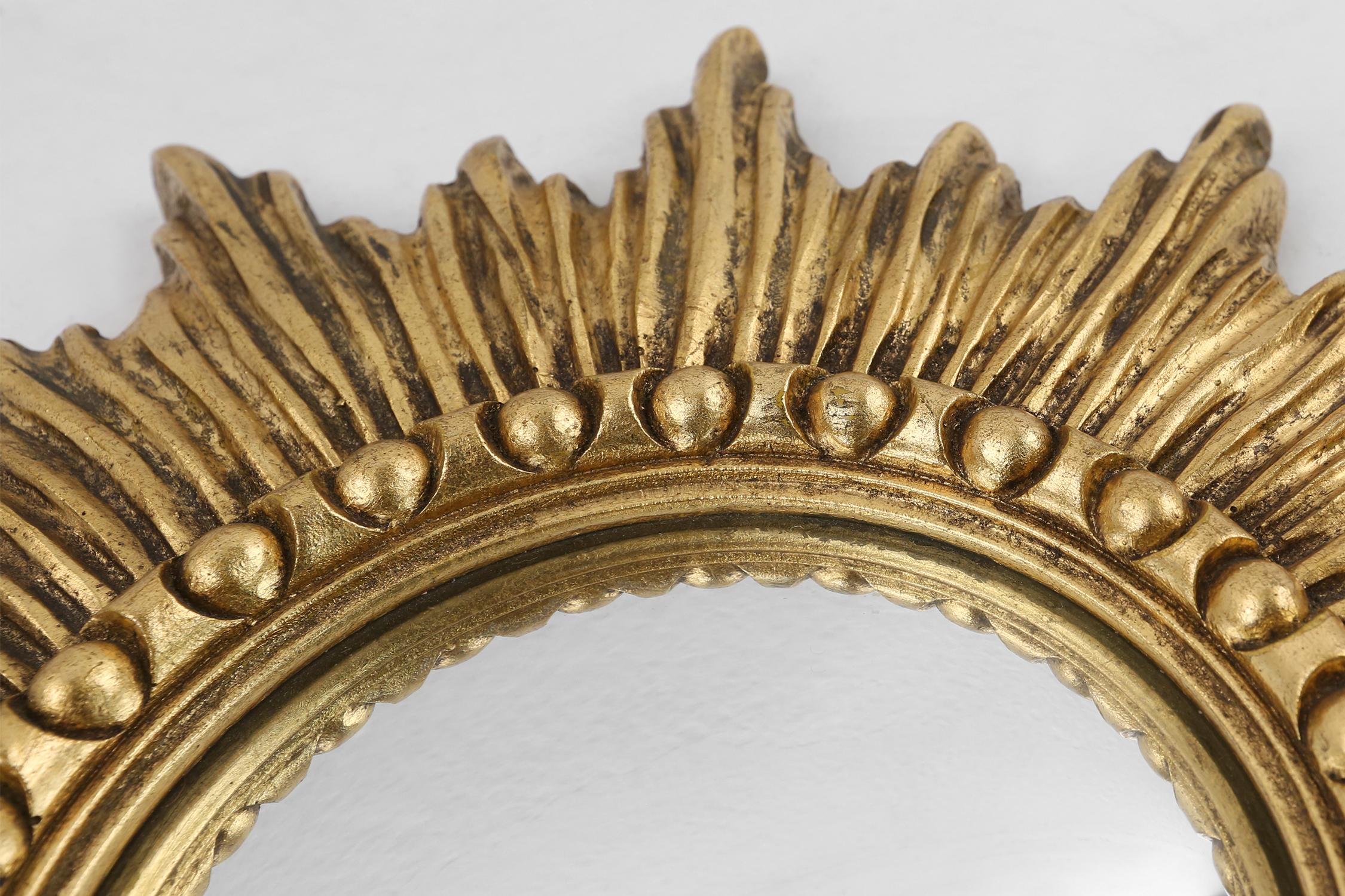 Mirror Gold sunburst mirror in resin with convex mirror, France ca. 1960 For Sale