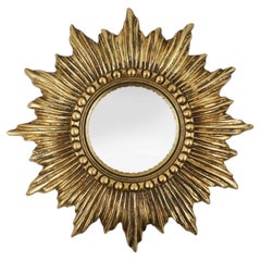 Gold sunburst mirror in resin with convex mirror, France ca. 1960