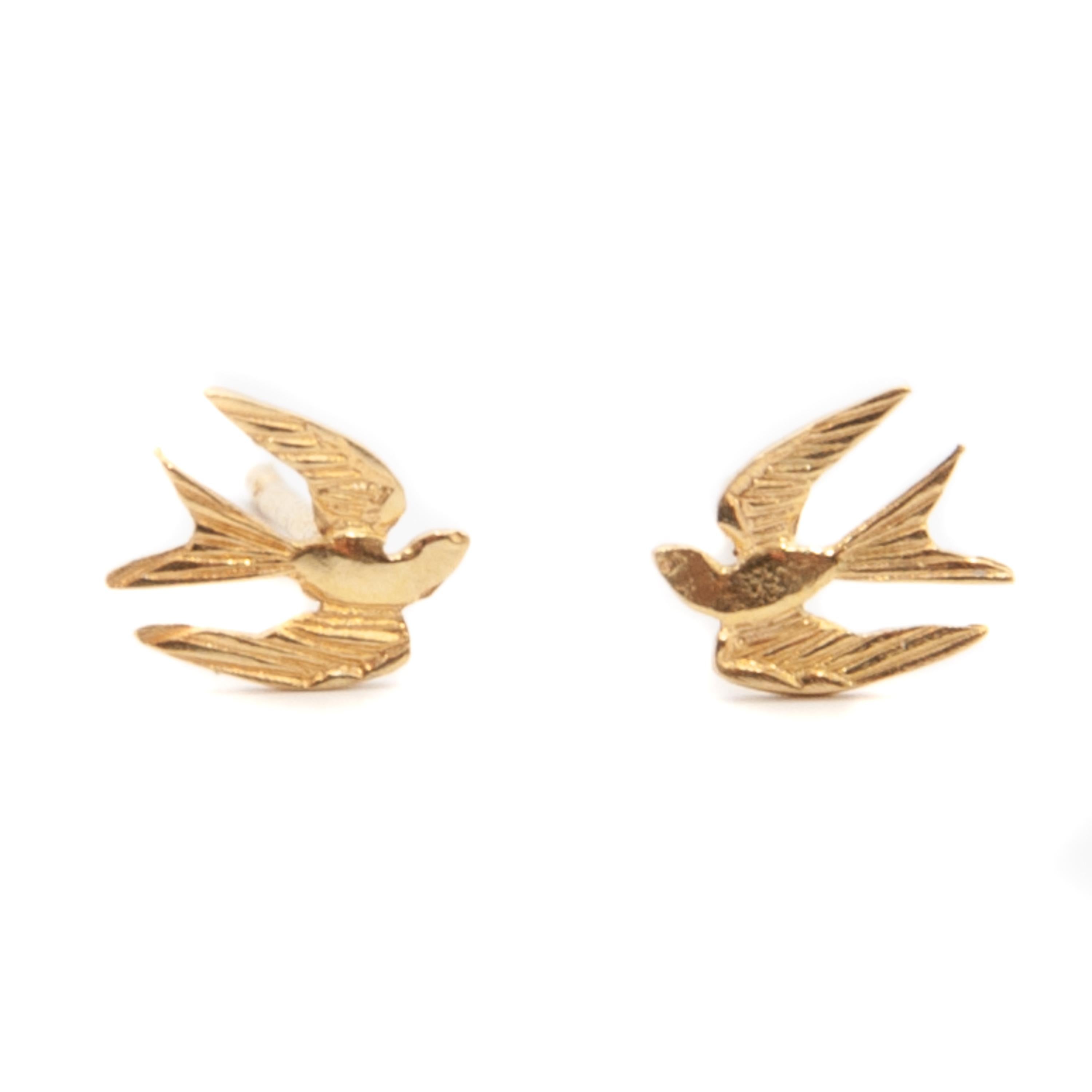 Timeless 18 karat gold flying swallow birds stud earrings. The swallow is a bird that represents love, care and affection towards family and friends, showing the loyalty of the person who always returns to them. The swallows also represent eternal