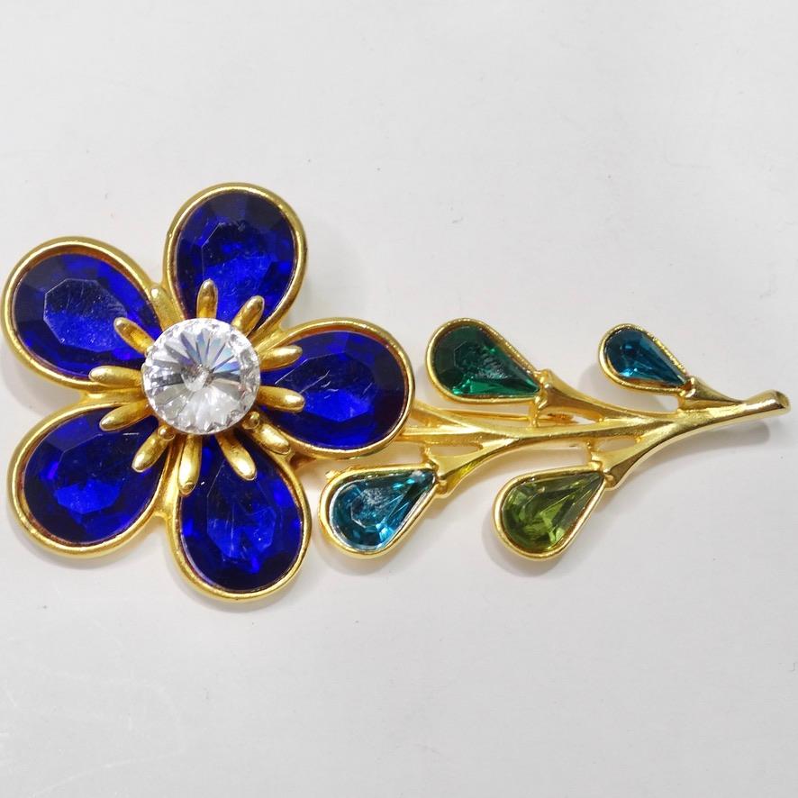 Calling all flower lovers! This 1980s flower brooch is going to become your next go-to accessory to spice up any outfit! Elevate your every day look with a pop of bling with this gorgeous flower brooch. Gold tone flower motif brooch is adorned in a