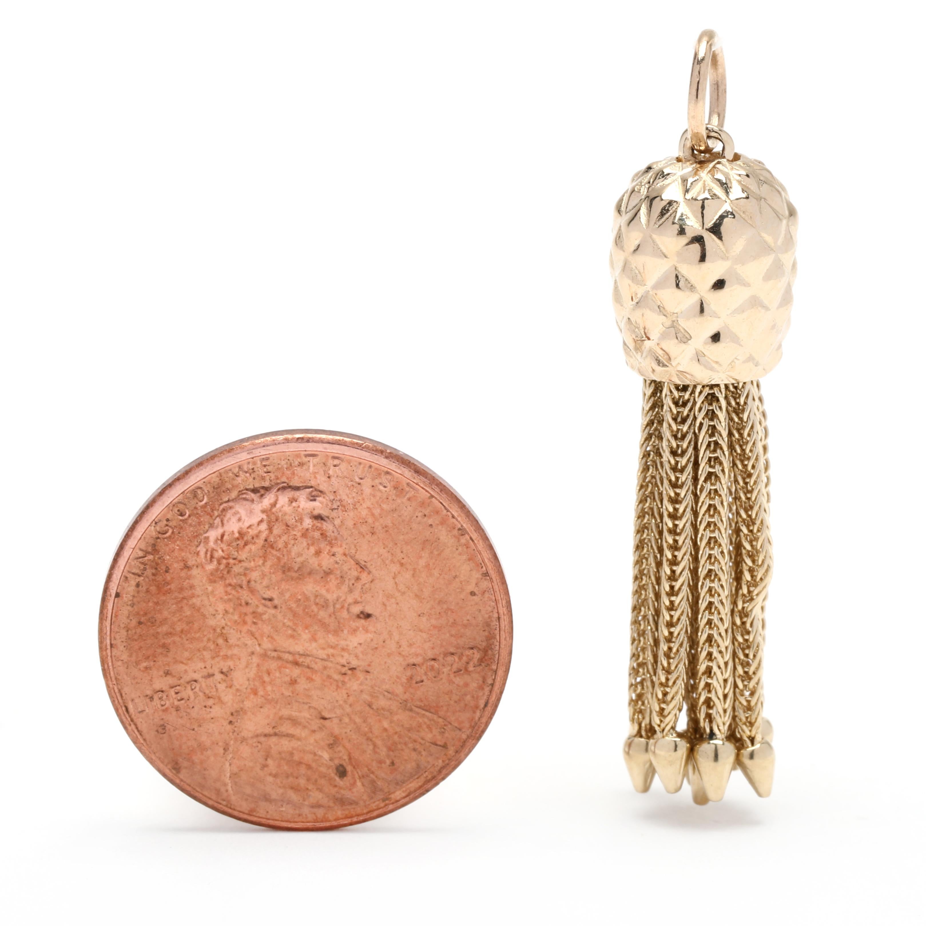 This 14K yellow gold acorn tassel charm is the perfect addition to any outfit! Its intricate design features a unique acorn-shaped charm with a delicate tassel, all crafted with quality 14K yellow gold. The pendant hangs from a medium-length chain,