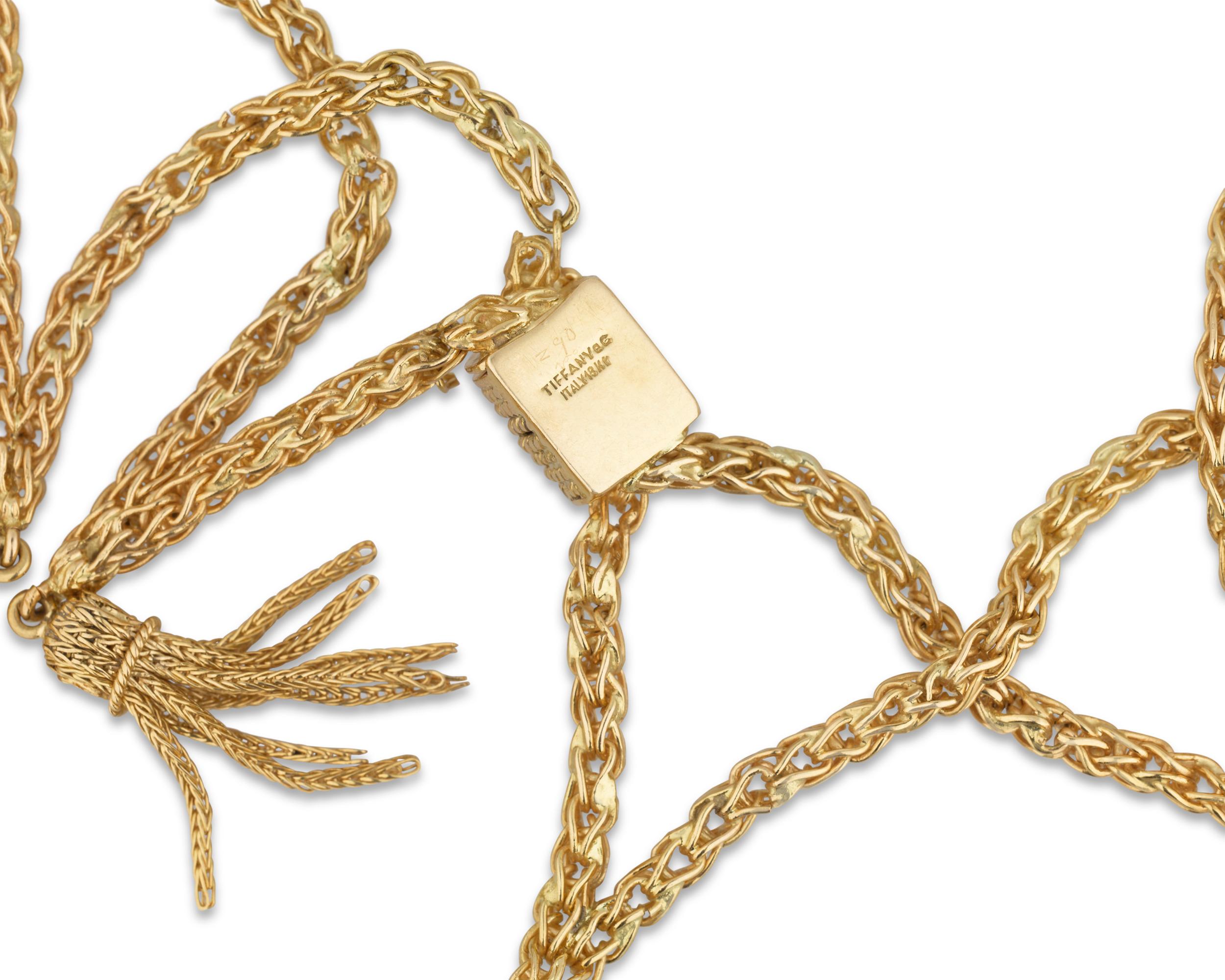 Chic 18K yellow gold tassels hang from a gold chain for a dynamic, contemporary look from the famed Tiffany & Co. This necklace exhibits a lace-like delicacy thanks to its overlapping structure, translating an organic sensuality into an iconic piece