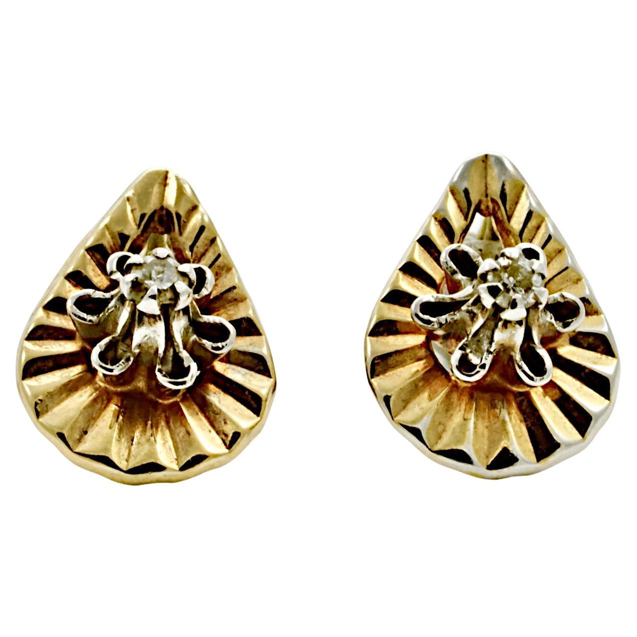 Beautiful gold teardrop diamond cut stud earrings featuring diamonds in fluted settings. The earrings test for gold, they are gilded in yellow gold with some wear. The 14K gold butterfly backs are stamped ZZ 14K, they are not the original backs.