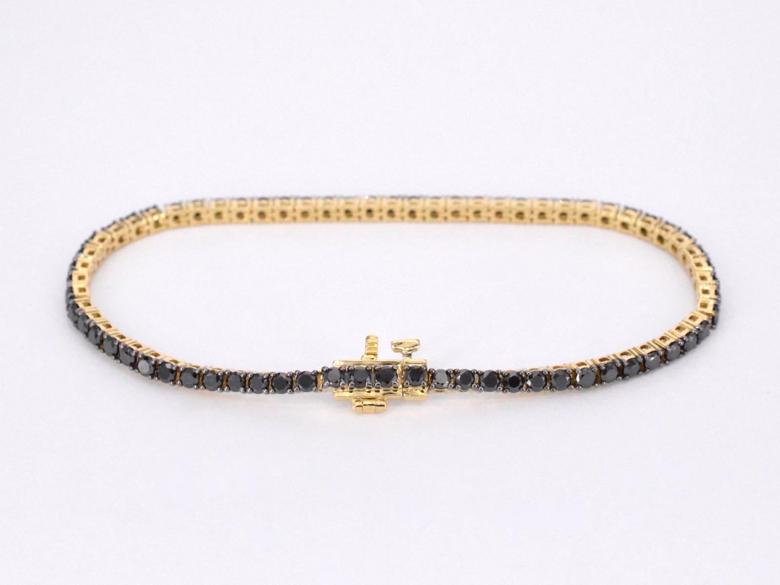 Contemporain Bracelet tennis en or serti de diamants noirs en vente