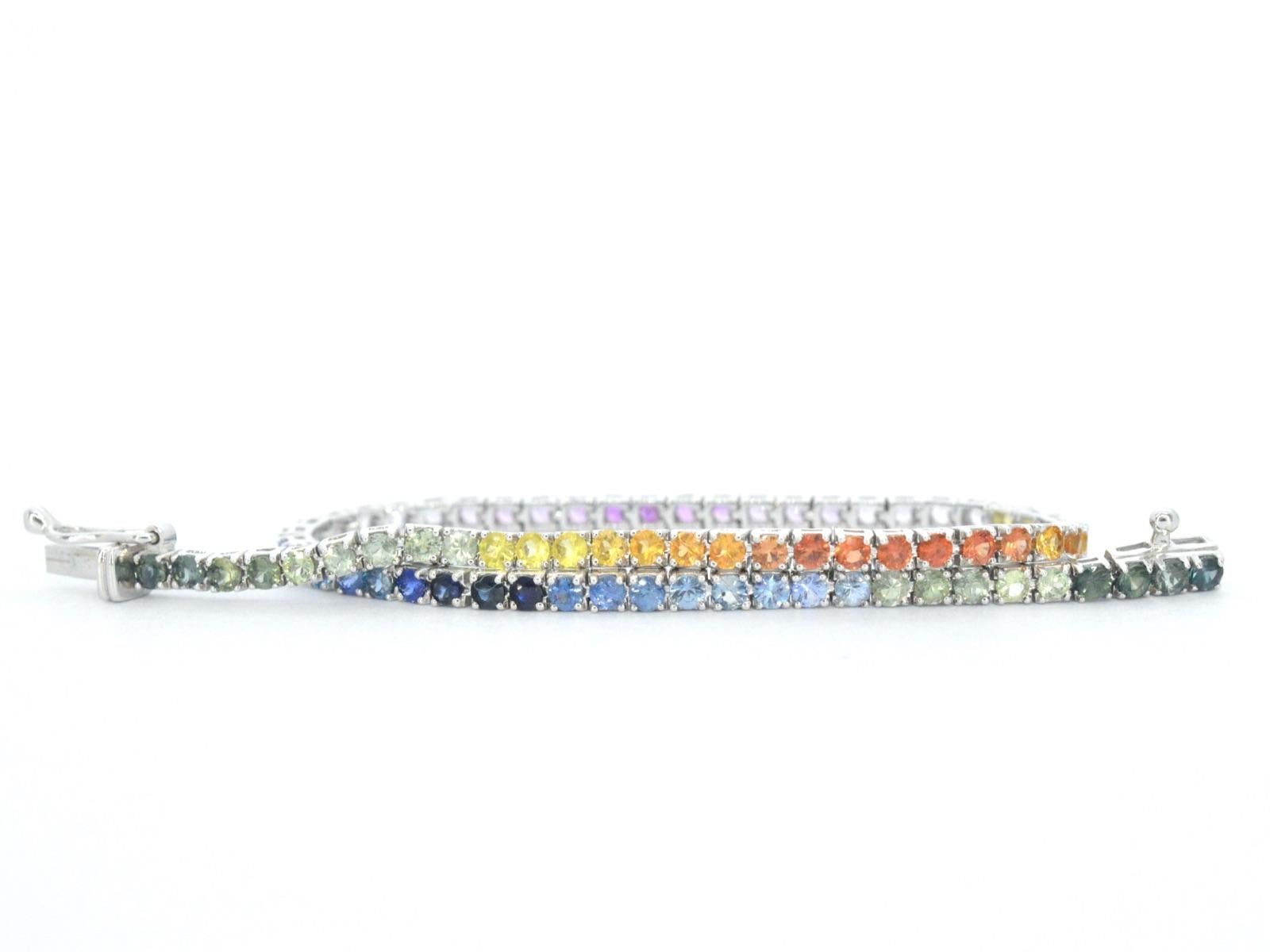 This exquisite bracelet features 77 brilliantly cut sapphires with a total weight of 3.60 carats. The sapphires are multicoloured, adding a vibrant and unique touch to this piece. Each sapphire has a grinding quality of 'very good', ensuring a