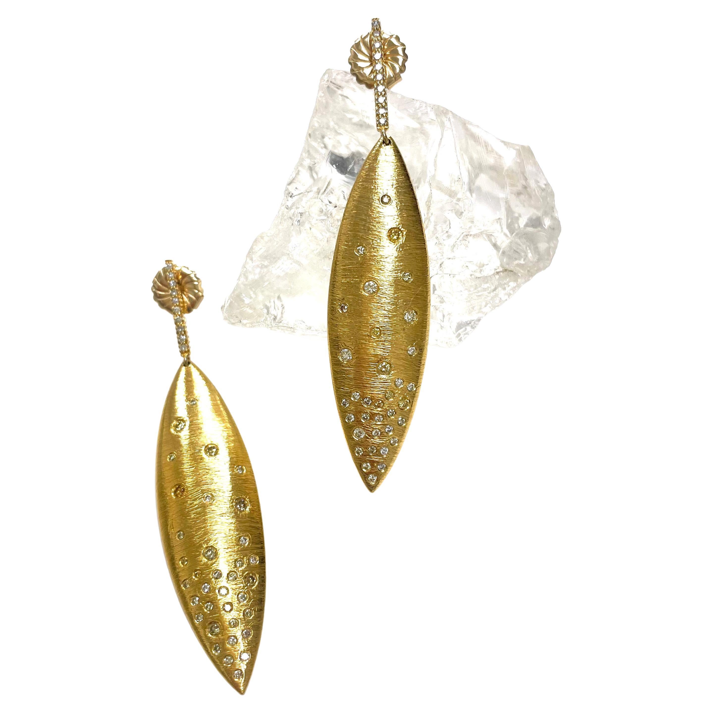 Description
Elegant textured 14k gold vermeil statement earrings, embellished with an asterism of diamonds which creates a beautiful and mystical effect. 
Item #E3080

Materials and Weight
Diamonds 1.31cts
Vermeil plated sterling silver
14k yellow