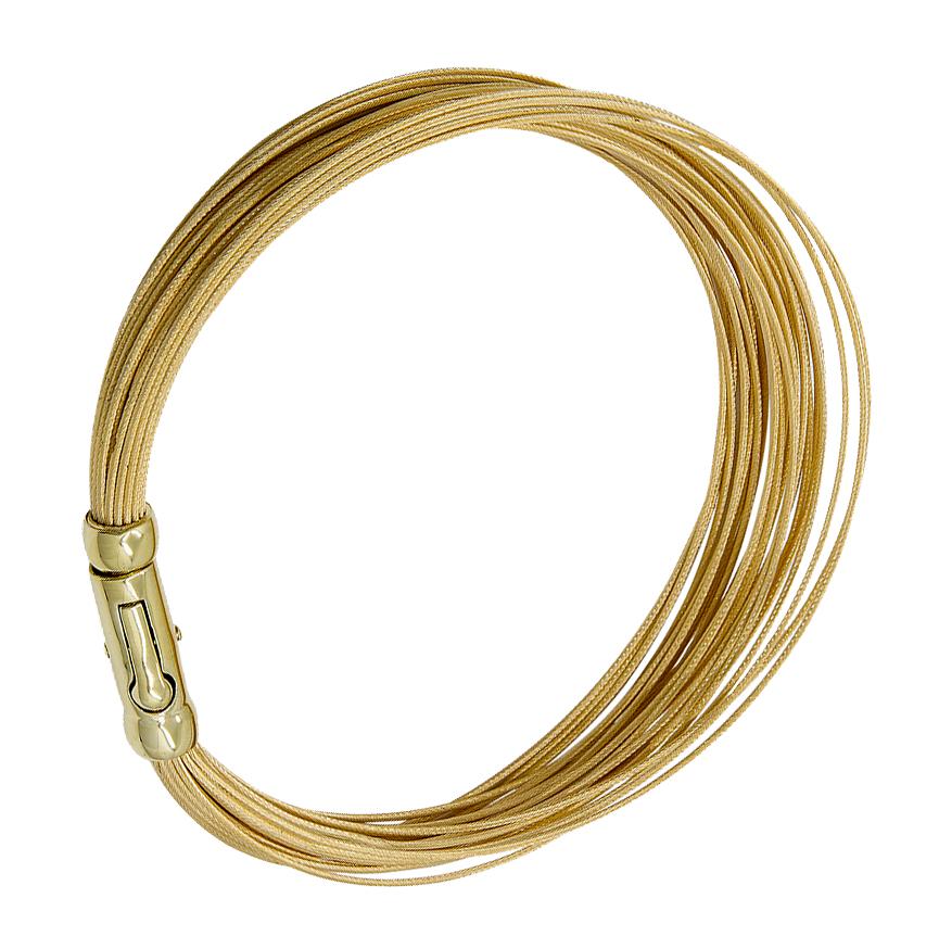 Lovely and graceful bracelet.  Made and signed by TIFFANY & CO.  18K yellow gold.  Comprised of thirty flexible wire strands.  18K yellow gold.  Fits an average size wrist.

Alice Kwartler has sold the finest antique gold and diamond jewelry and
