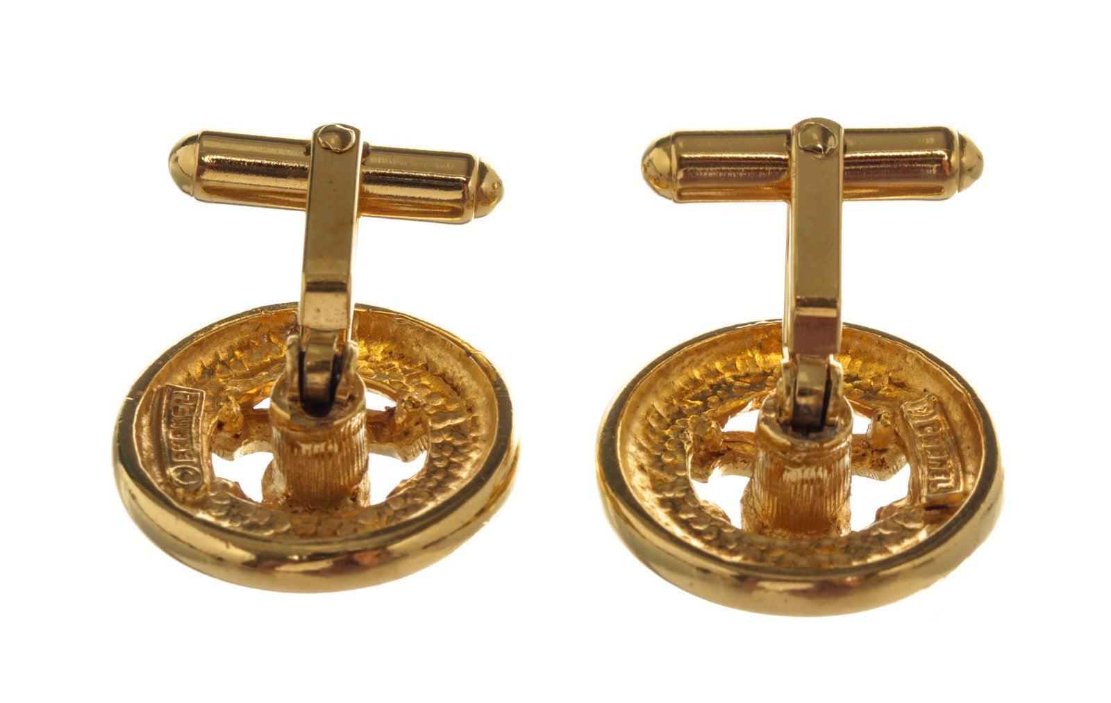 Gold-tone and round Chanel CC cufflinks with iconic Chanel logo in the center and gold-tone hardware.
 

54330MSC