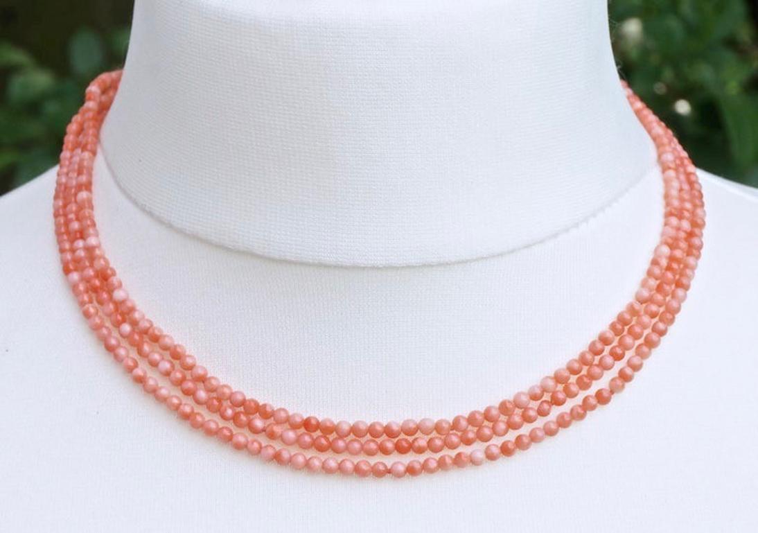 Gold Tone and Triple Strand Salmon Pink Coral Bead Necklace circa 1970s In Good Condition In London, GB