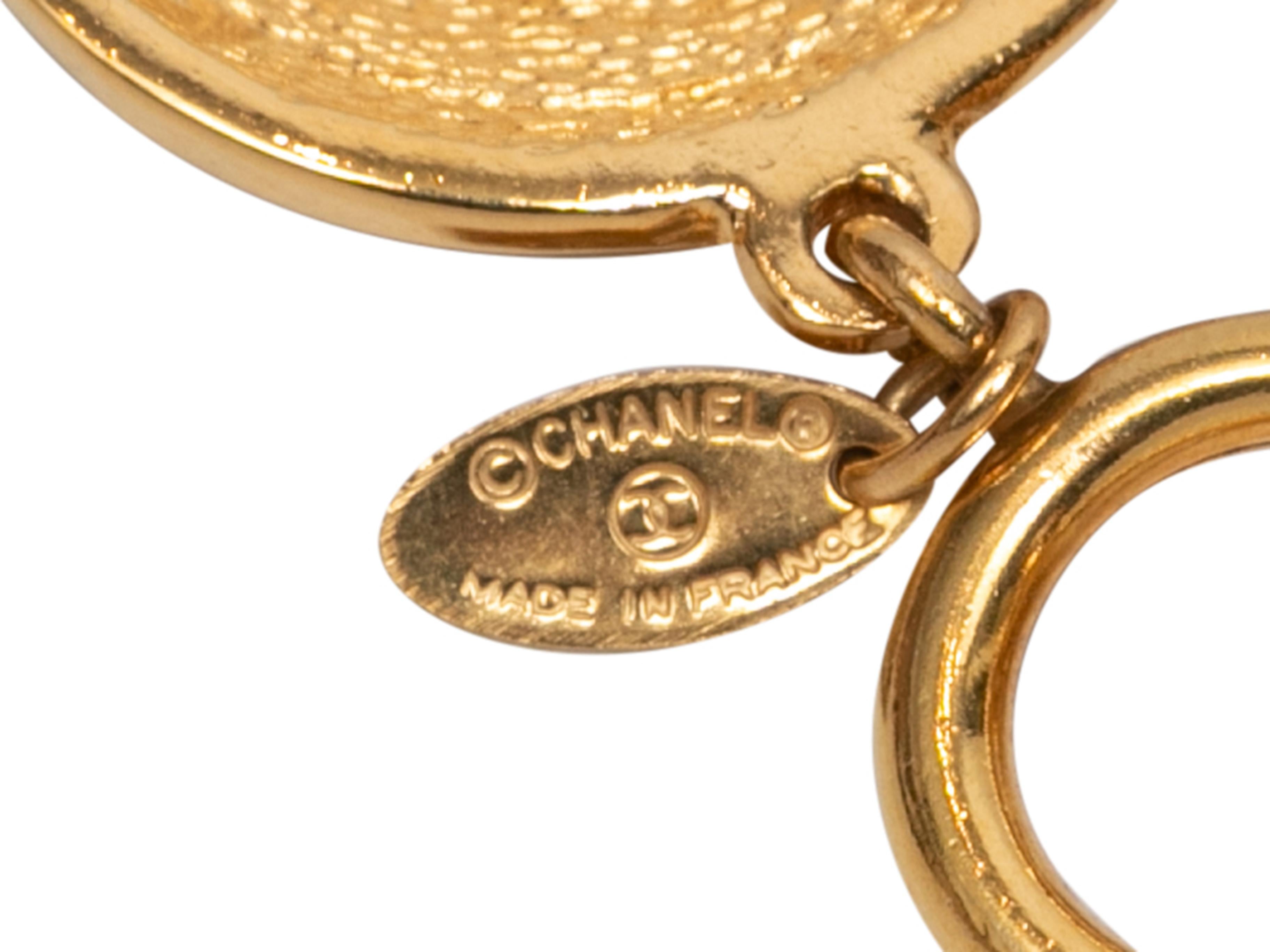Gold-tone CC medallion bracelet by Chanel. Clasp closure. 5