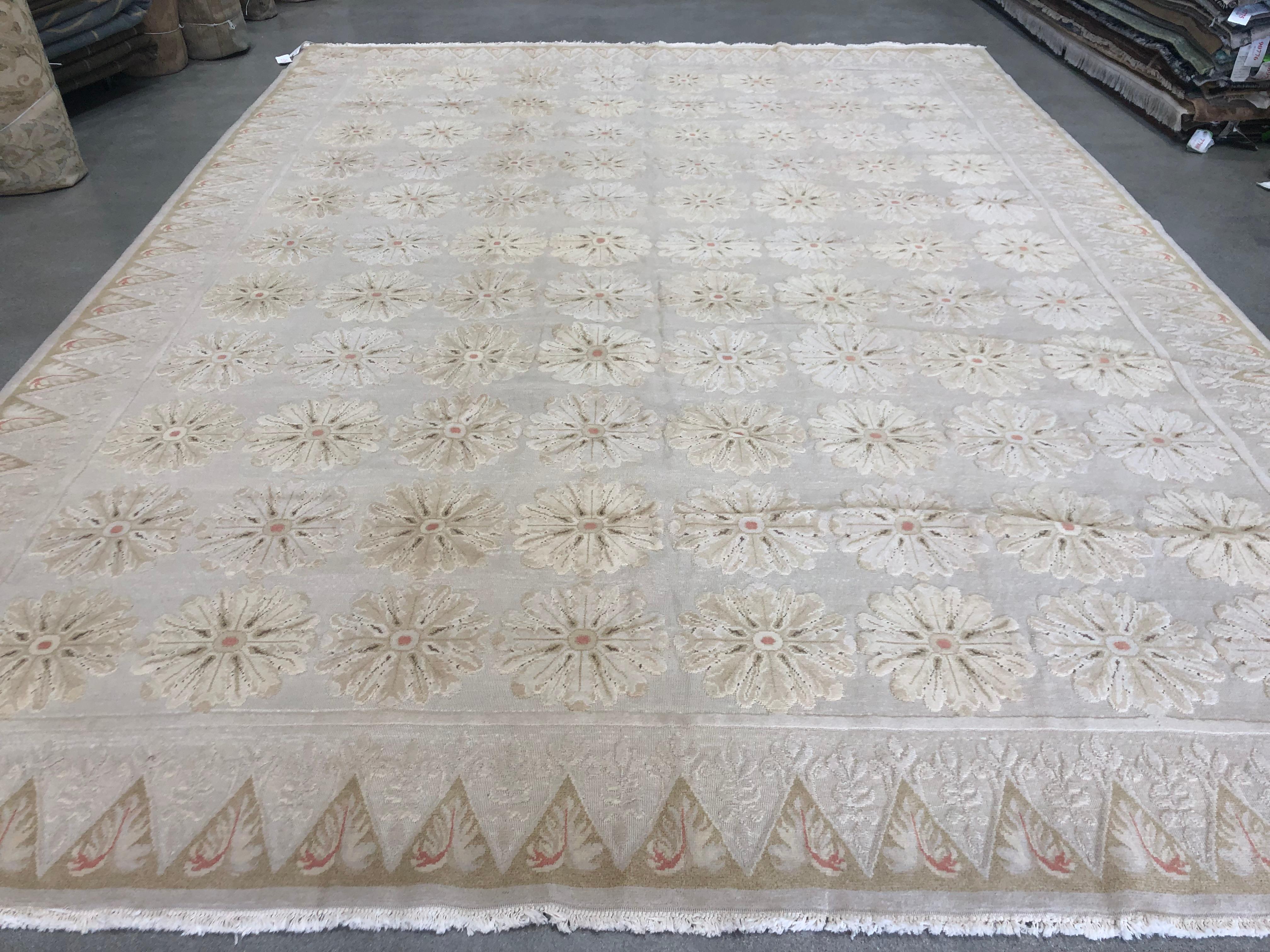 The lustrous gold tones of this elegant rug bring to mind a lush brocade underfoot. The look of silk with the durability of wool. Handmade in Europe.