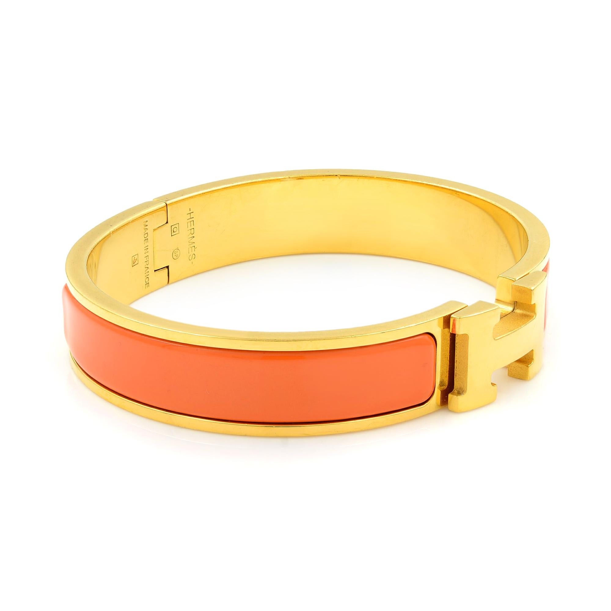 Gold Tone Hermes Orange Clic Clac Bangle Bracelet In Good Condition In New York, NY