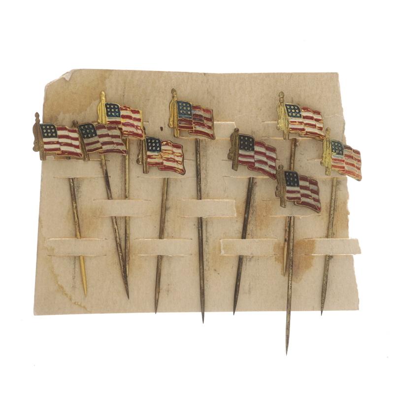 Date: 1920s - 1930s

Metal Content: Gold Toned

Material Information
Enamel
Color: Red, White, & Blue

Style: Set of 9 Stickpins
Theme: Patriotic American Flag

Measurements

Item 1: Longest Stickpin
Face Height (north to south): 9/16