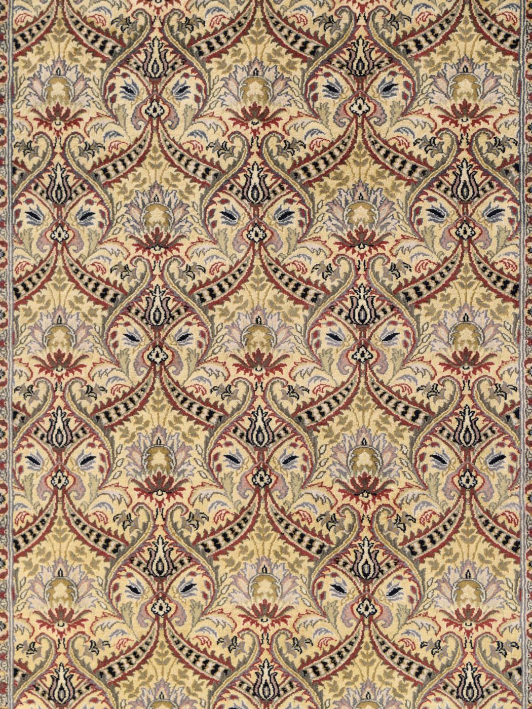 With a warm golden background and an all-over green garland design, this Semnan-inspired carpet was woven in Pakistan and measures 4 ’x 6’. The Semnan design is composed of blooming flower motifs, encompassed by red and green detail garlands. Poetic