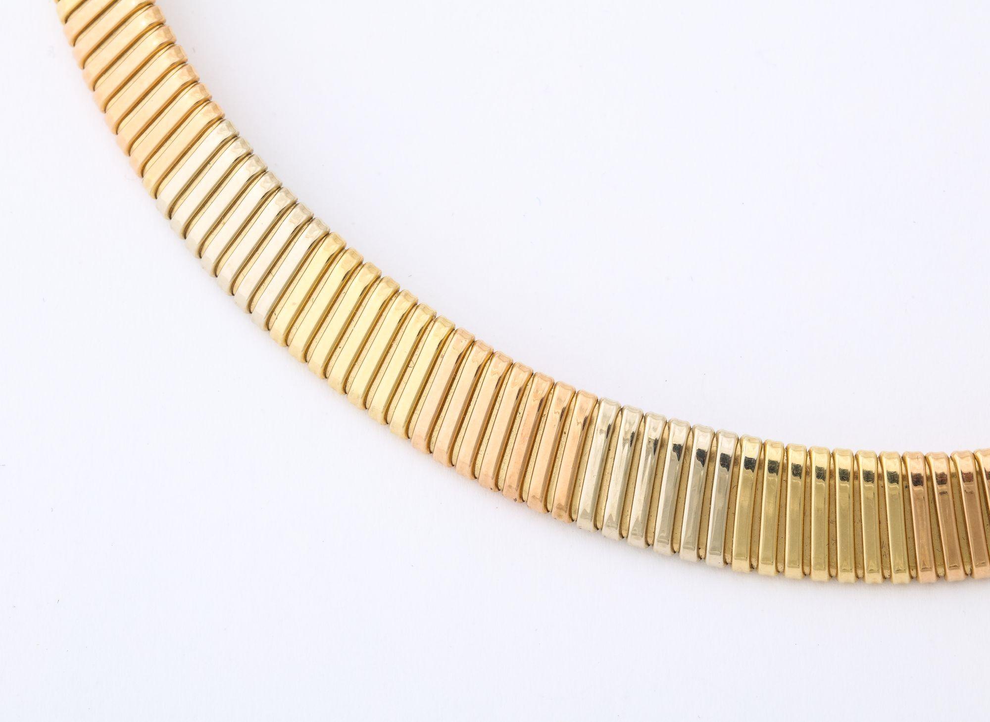 This tricolor 14 K gold necklace is very day wearable and very desirable .  It can be worn alone  and also with a clip 
attached.
