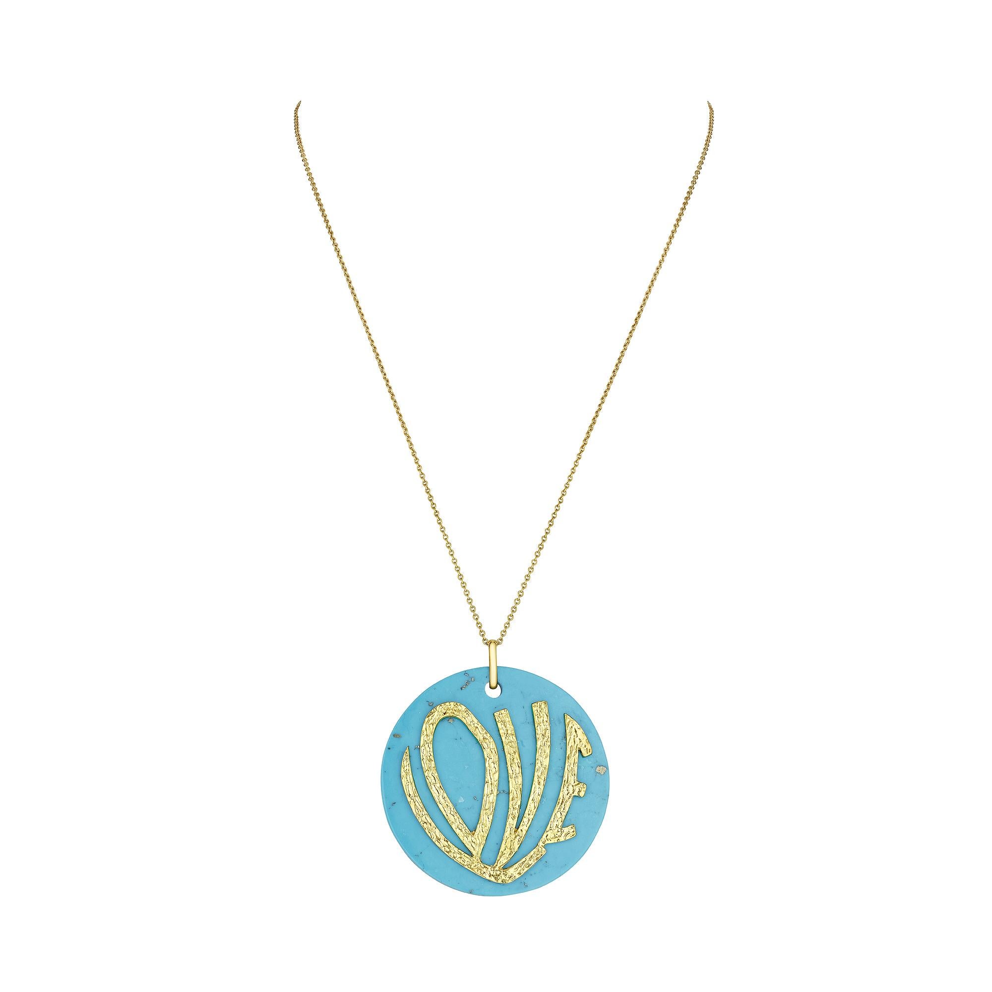 Show your love in full sight with this 1970's inspired large turquoise love pendant necklace.  This bold and colorful turquoise disc, with the hammered 18 karat yellow gold word LOVE stylishly applied to the front, makes this necklace a powerful and