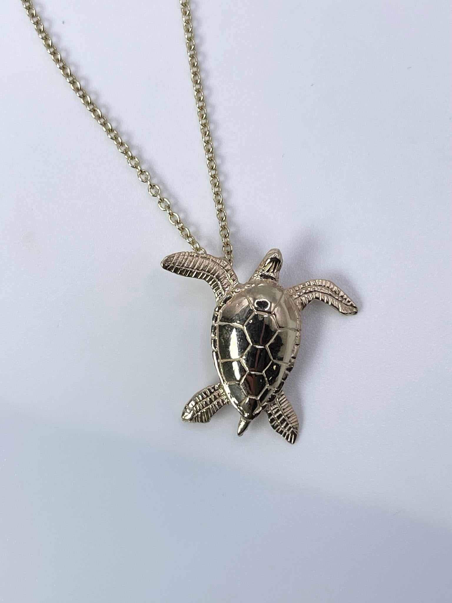 Elegant sea turtle pendant in 14KT yellow gold. The pendant comes with a chain, certificate and box. Ready to ship!

GRAM WEIGHT: 2.85gr
GOLD: 14KT yellow gold
WIDTH: 19mm
LENGTH: 18mm


WHAT YOU GET AT STAMPAR JEWELERS:
Stampar Jewelers, located in