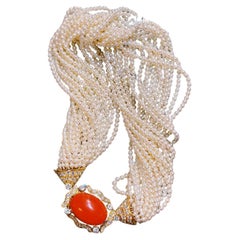 Collana con girocollo in oro, perle d'acqua dolce a venti file, corallo e diamanti