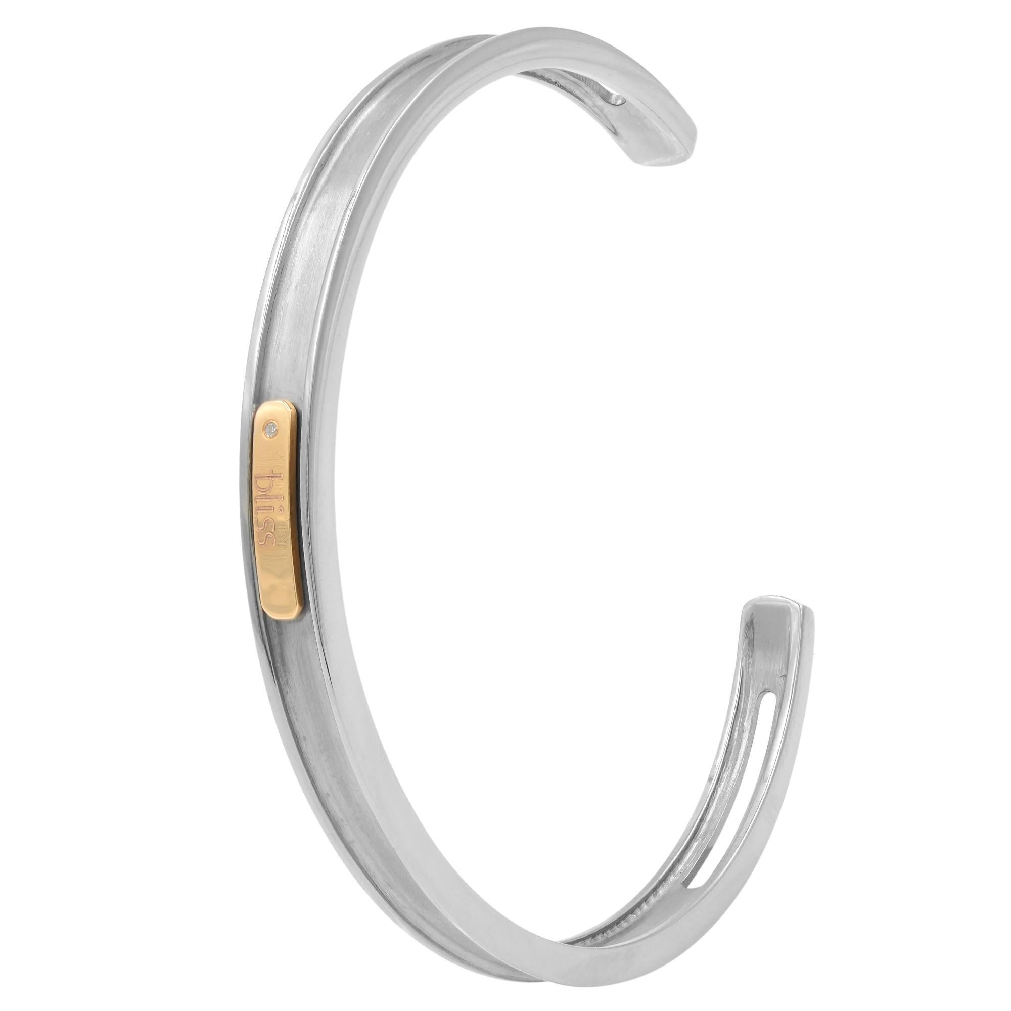 Celebrating the uniqueness, BLISS by Damiani Unisex Cuff Bracelet Bangle crafted in Gold Tytanium with 18K rose gold and flush set diamond. Inspired by the contemporary vision and traditional beauty, this bracelet features a Logo-engraved bar