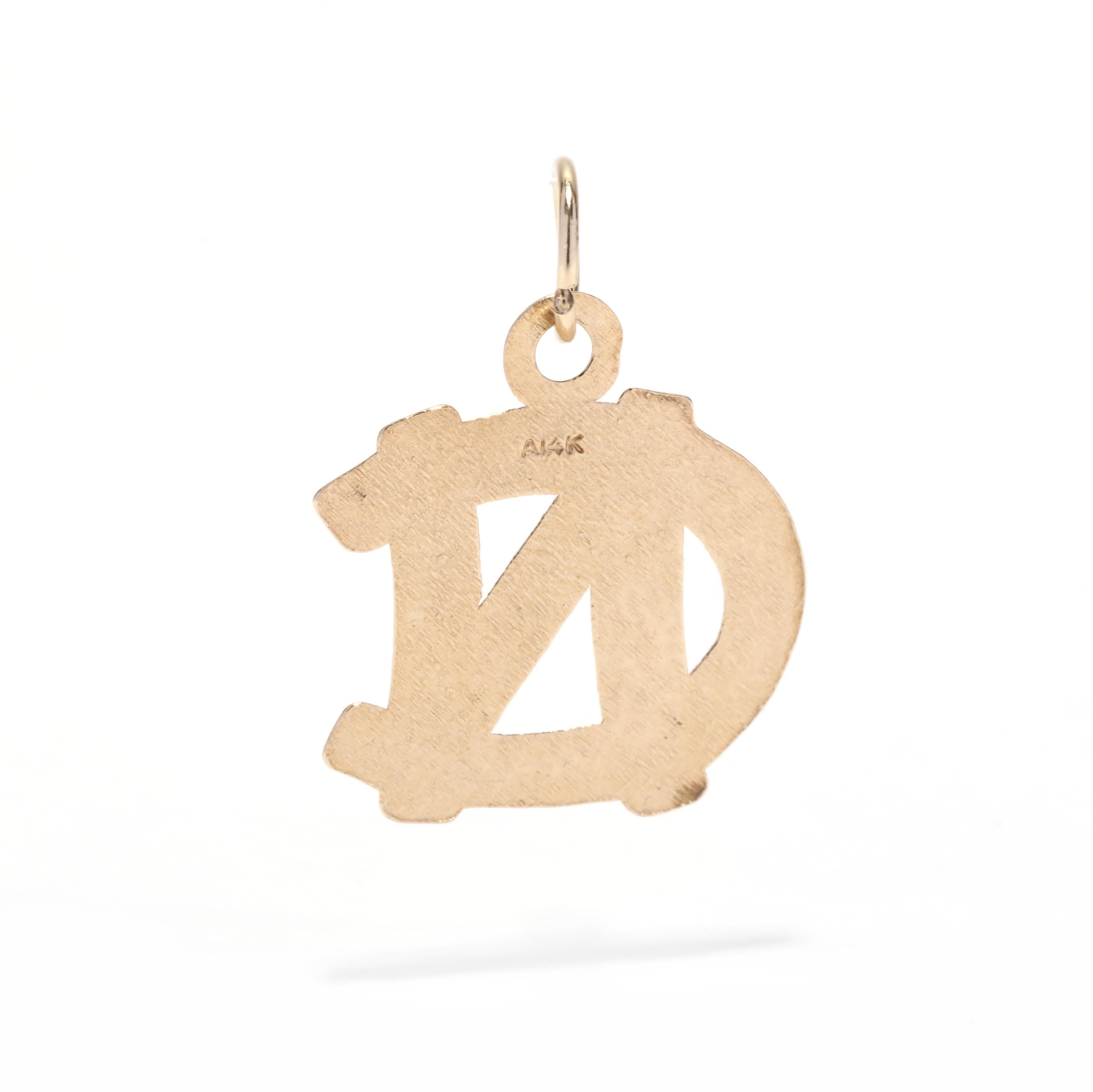 A vintage 14 karat yellow gold University of North Carolina at Chapel Hill charm. This charm features the NC emblem of the university with a polished finish and bevel edges. Perfect for a graduation gift!

Length: 7/8 in.

Width: 5/8 in.

Weight:
