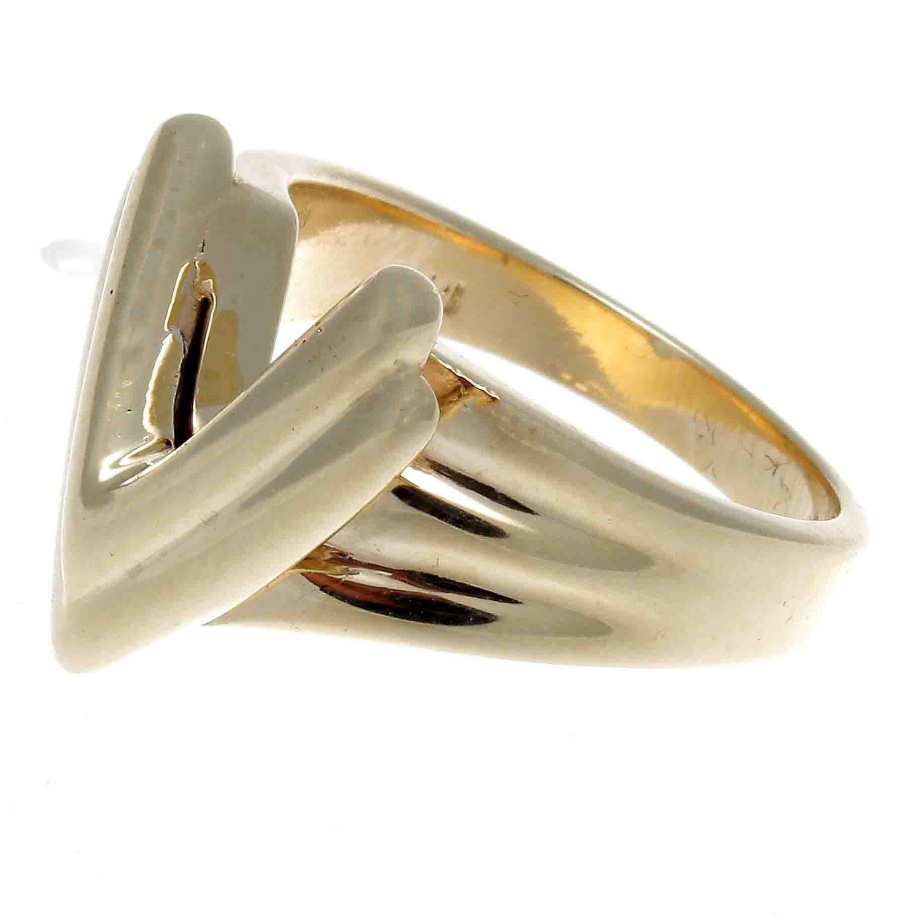 Glistening gold formed into rigid lines create this stylish ring. Featuring a V to stand for that special word of yours or simply its just that futuristic design you were looking for. Crafted in 14k gold.

Ring size 5 and may easily be resized, if